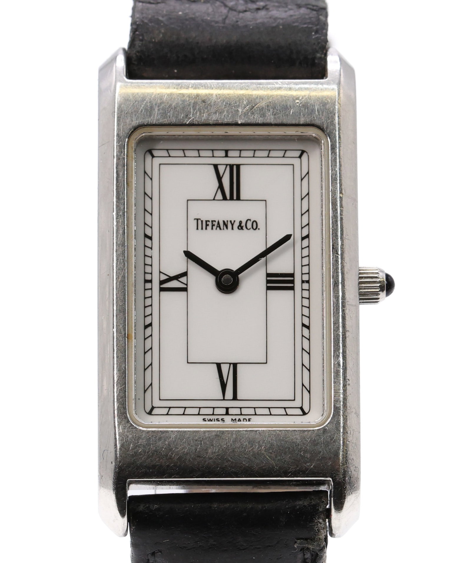 Tiffany & Co. Portfolio, Stainless Steel Quartz Wristwatch: Stainless steel rectangular case, 20 x 38 mm, with smooth bezel and minimalist design. White dial with simple markers, signed Tiffany & Co. Powered by a quartz movement. Fitted with a black leather