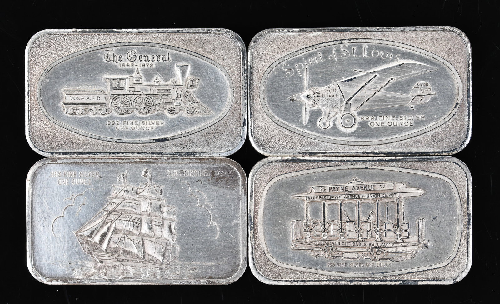 Madison Mint Fine Silver Ingots: Fine silver ingots including "The General", "The Spirit of St. Louis", "Old Ironsides", and "Cleveland City Cable Railway", minted circa 1970's. (4) ingots. Each approx. 2” x 1”. Overall