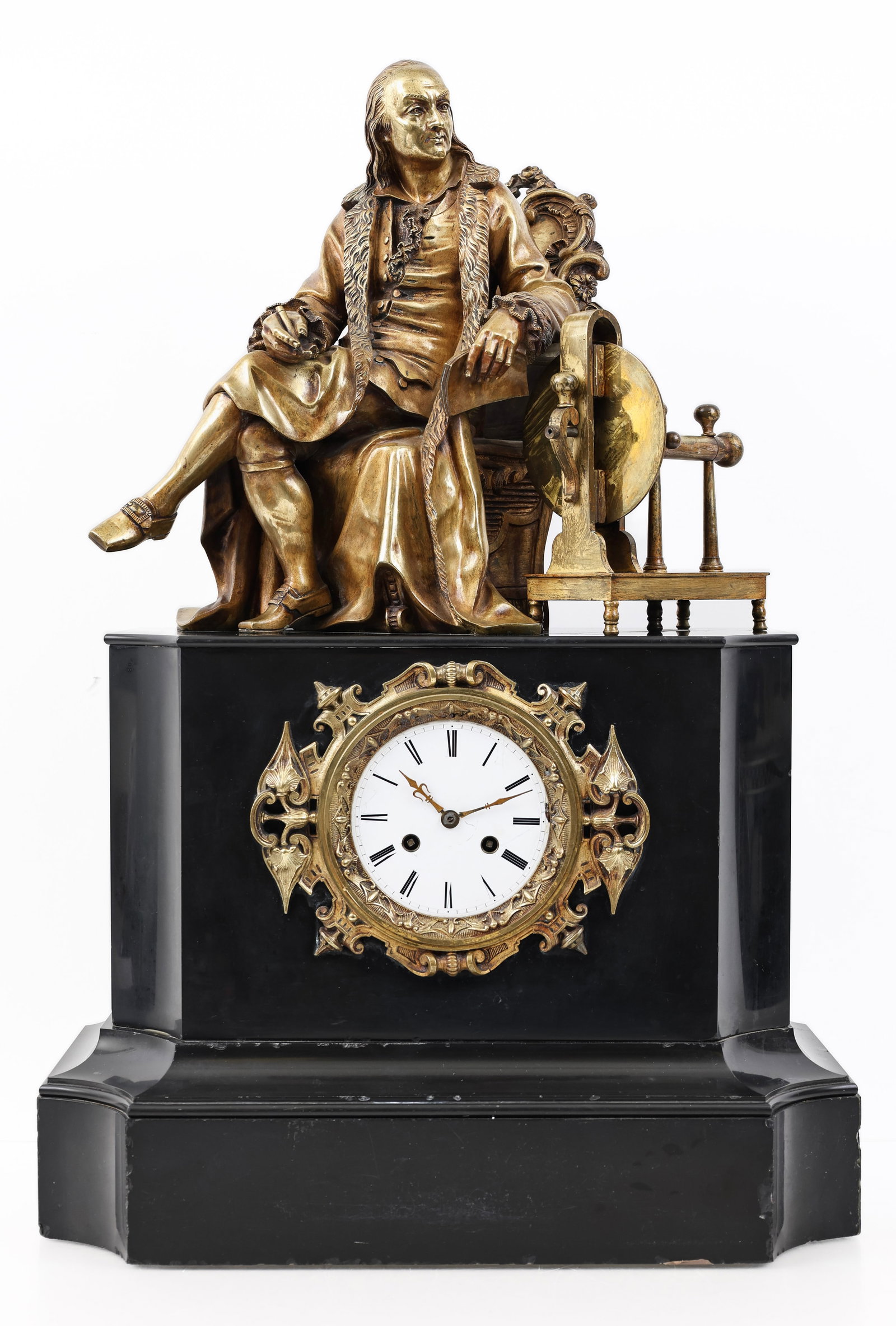 Japy Freres Benjamin Franklin Mantel Clock: Gilt bronze sculpture of Benejamin Franklin sitting in a chair atop a black slate molded plinth base. Enamel dial surrounded by ormolu mounted c-scroll decoration. 8-day brass strike and pendulum
