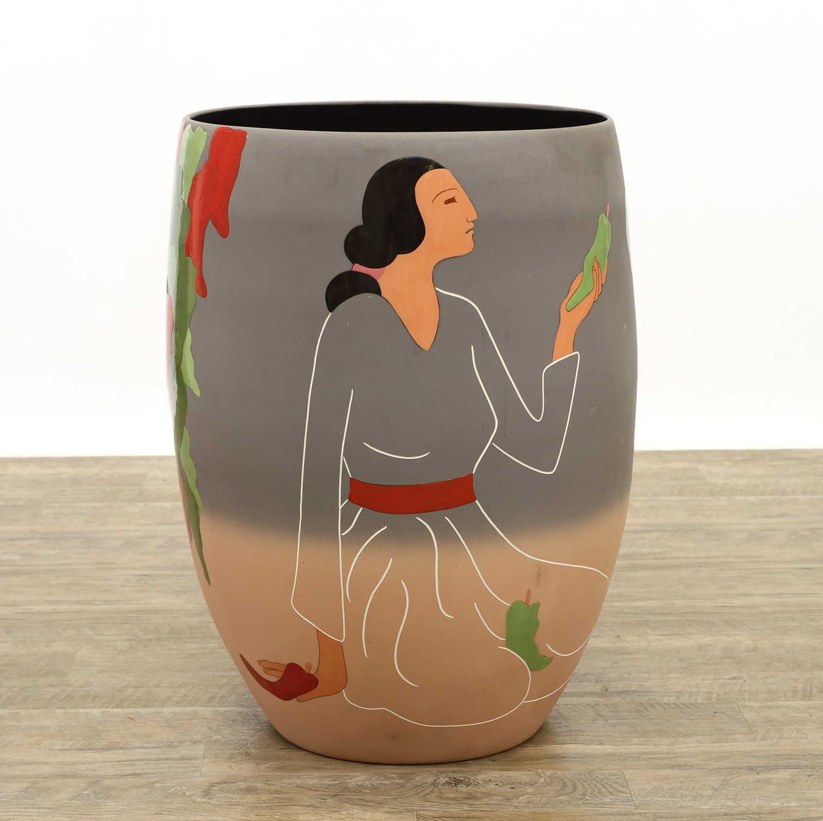 R.C. Gorman (1931 - 2005): Hand cast ceramic vase, "Lady With Ristras", forest green, fern green, flaming red, black, walnut brown, and Indian red, hand signed and numbered 54/200 at the base, also hand signed to the foot,