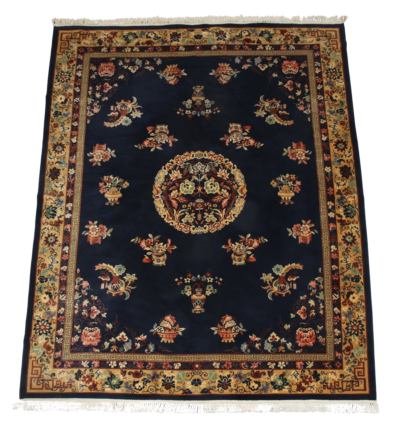 Chinese Art Deco Rug: Hand woven with a circular central floral and foliate medallion with surrounding floral, foliate and vase motifs in a blue ground, meandering running water motif along the inner border and a floral an
