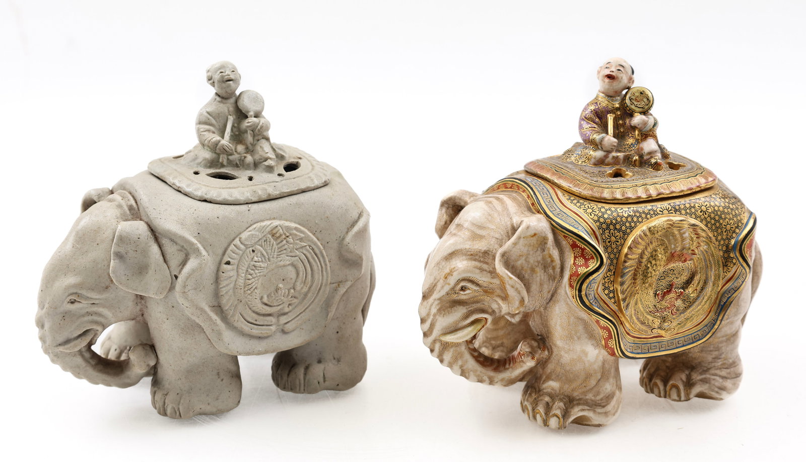 Senzan Japanese Satsuma Pottery Elephant Censer and Complementing Blank: Meiji - Taisho era Satsuma elephant form censer decorated with moriage phoenixes, floral motifs and meanders, with a pierced cover surmounted by a finial in the form a boy playing a temple taiko drum.