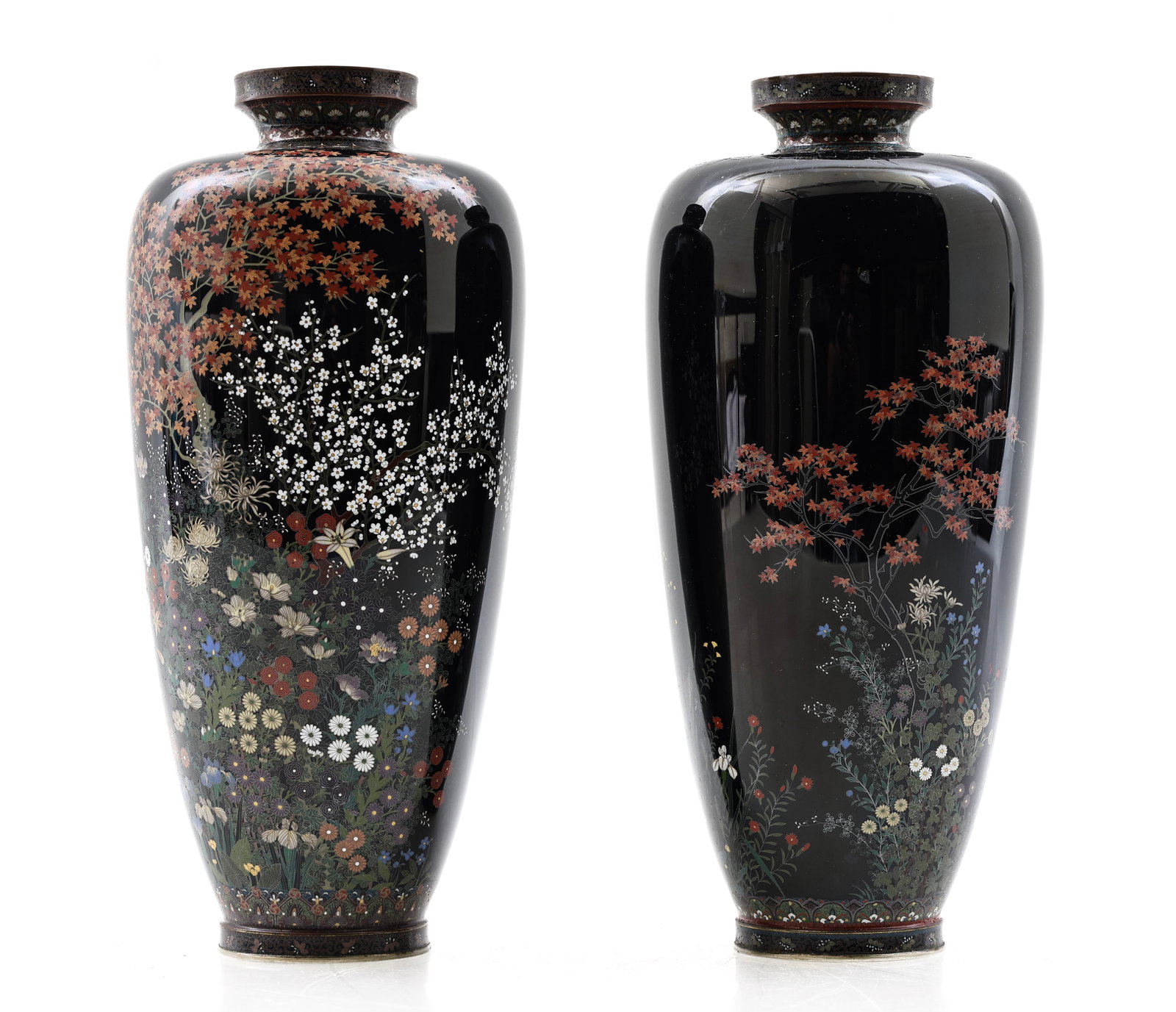 Miwa Tomisaburo Japanese Cloisonne Vases: Meiji era complementing pair of silver wire cloisonne vases with silver plate mounts, decorated with flowers on a black ground, with lappet bands around the foot and mouth showing floral motifs and bu
