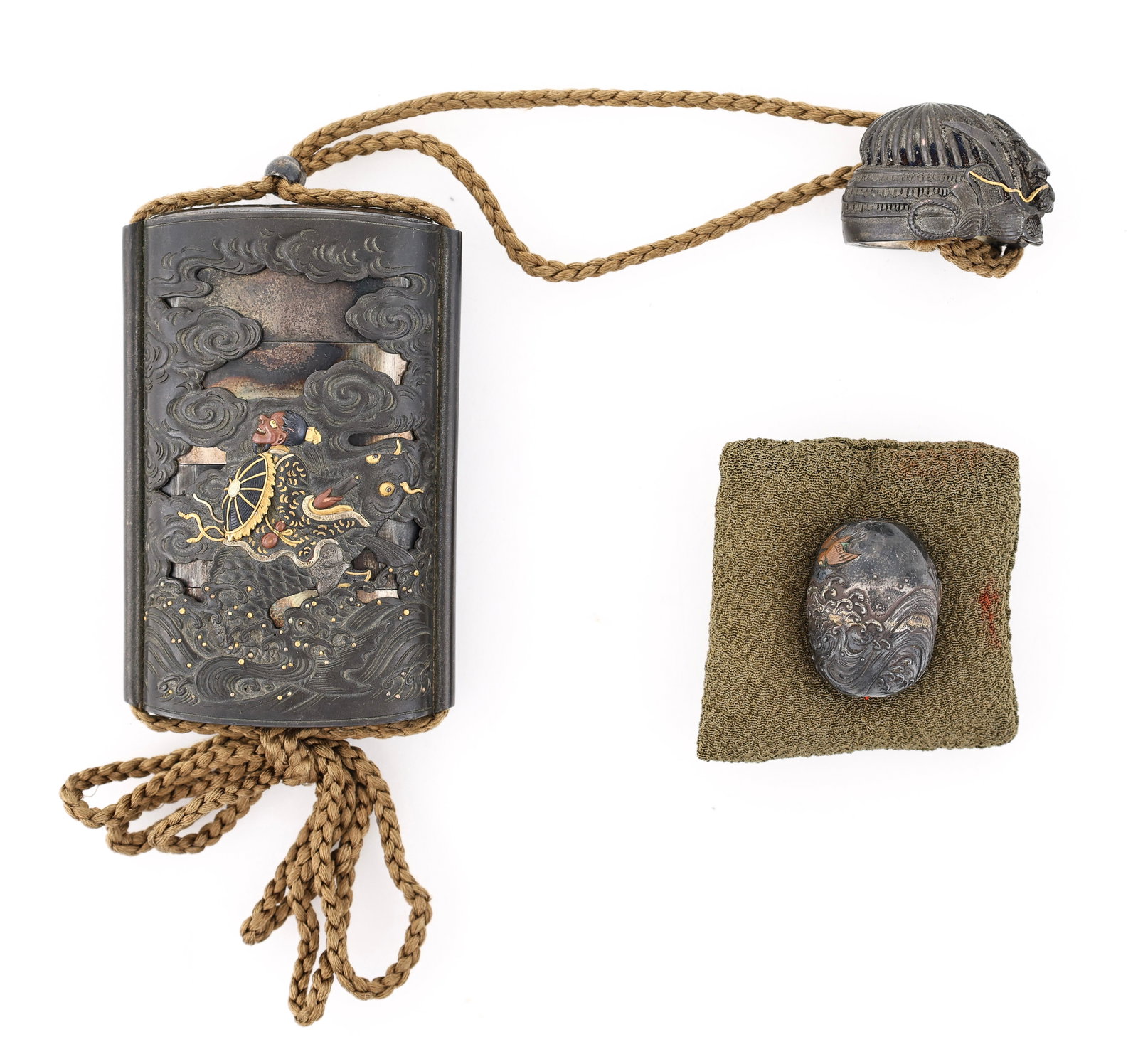 Japanese Silver Saya Inro: Edo - Meij era silver three-case inro fitted in a shibuichi saya sheath, chased and decorated with inlaid gold, silver, shakudo, and copper in relief depicting Fukurokuju (God of Longevity) riding a f