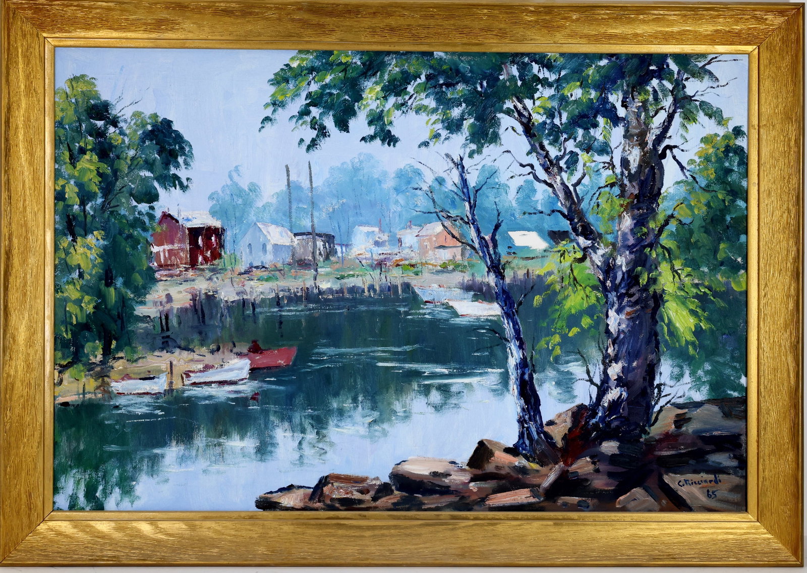 Cesare A. Ricciardi (1892 - 1973): Oil on canvas, SDLR '65. Impressionist harbor scene with small boats along a calm shoreline and houses in the distance. 24"h x 36"w and 28.25"h x 40"w framed