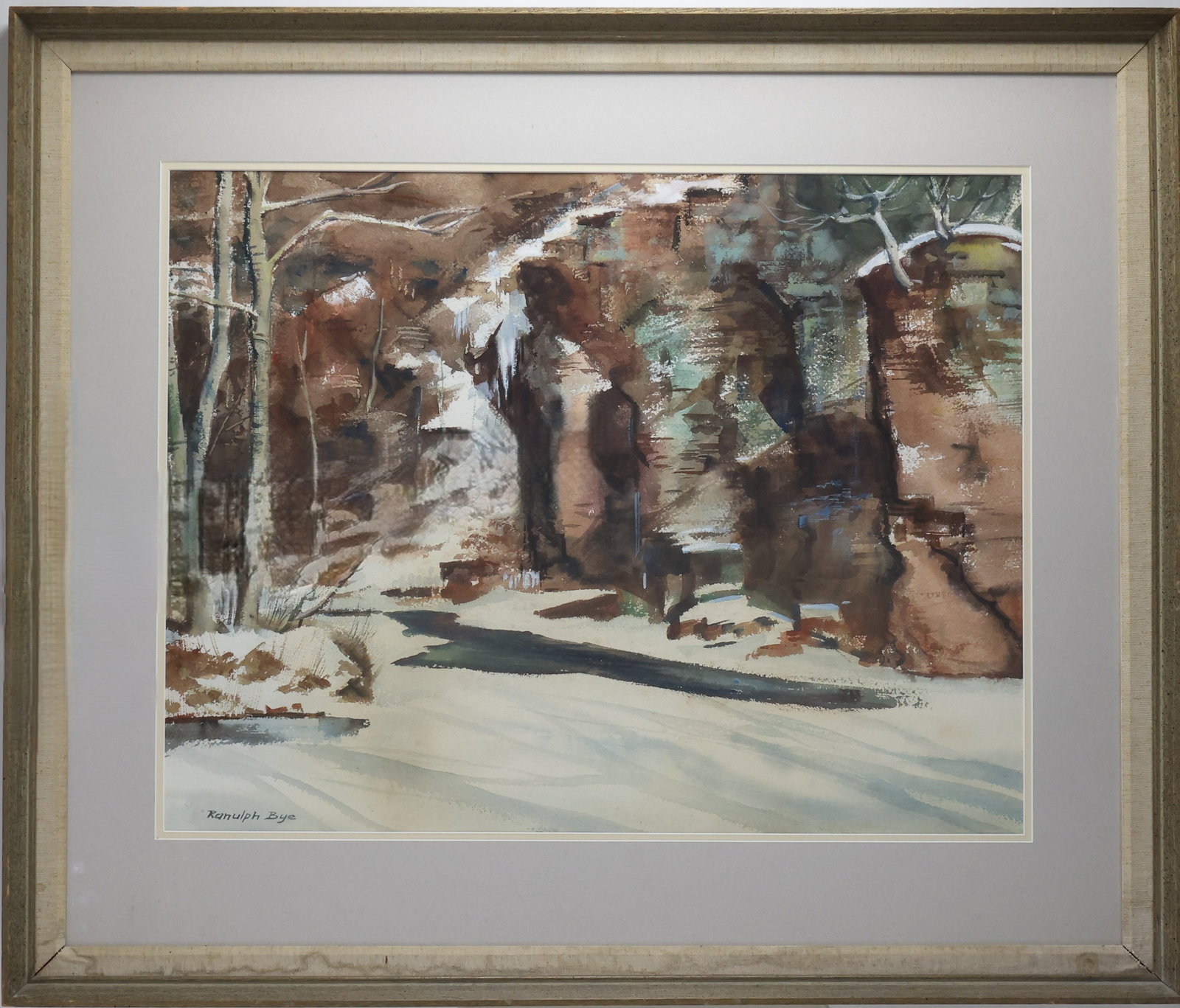 Ranulph Bye (1916-2003): Watercolor on paper, "Erwinna", SLL. Impressionist winter landscape with snow covered water passing along red rock cliffs and trees. 21"h x 27"w sight and 31"h x 37"w framed