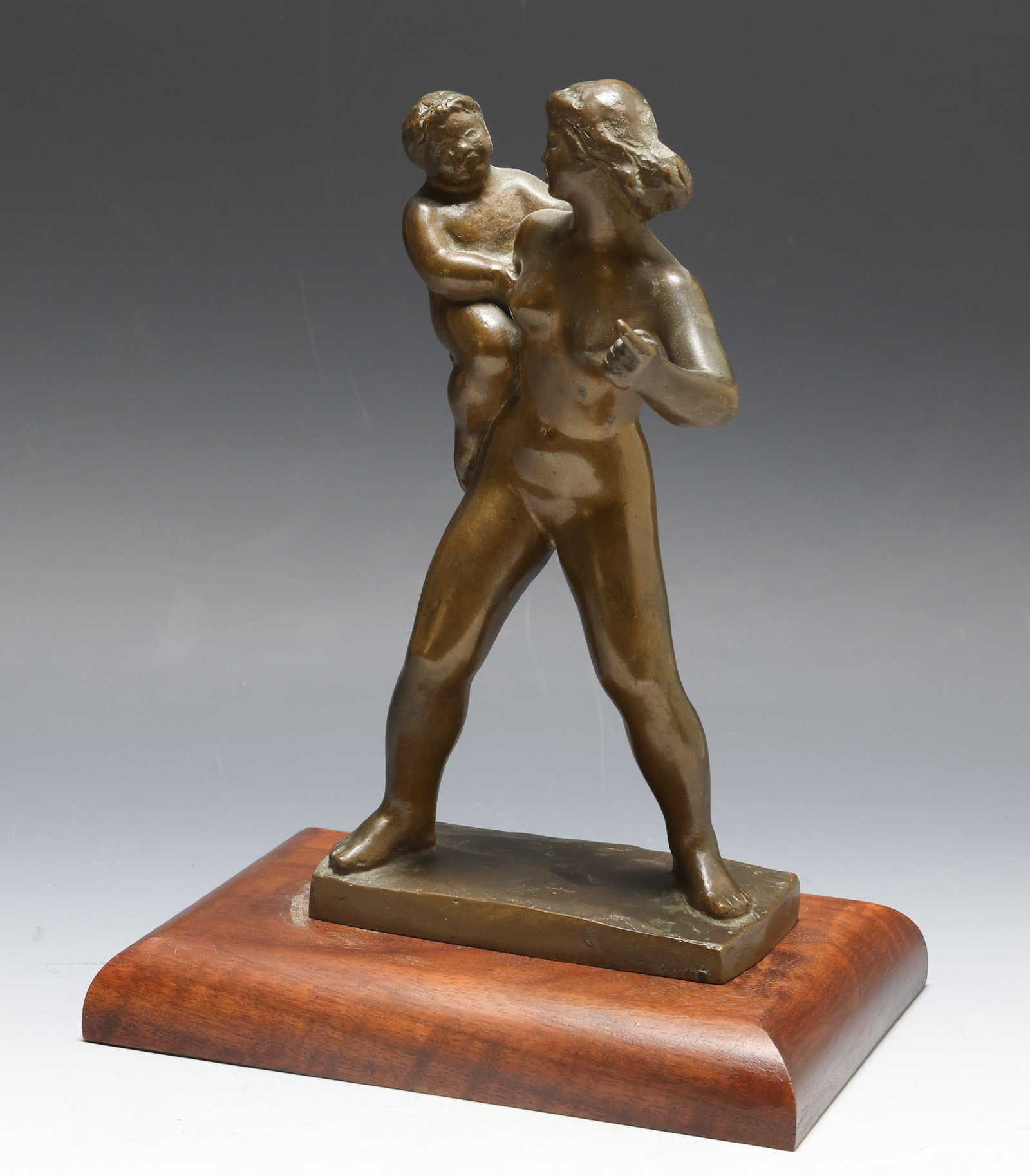 Harry Rosin (1897 - 1973): Bronze sculpture, depicting a nude mother and child, mounted to a walnut stand. Impressed signature to the base en verso. Sculpture 9"h x 4.75"w x 4.75"d, overall 10.25"h x 7.5"w x 5.75"d