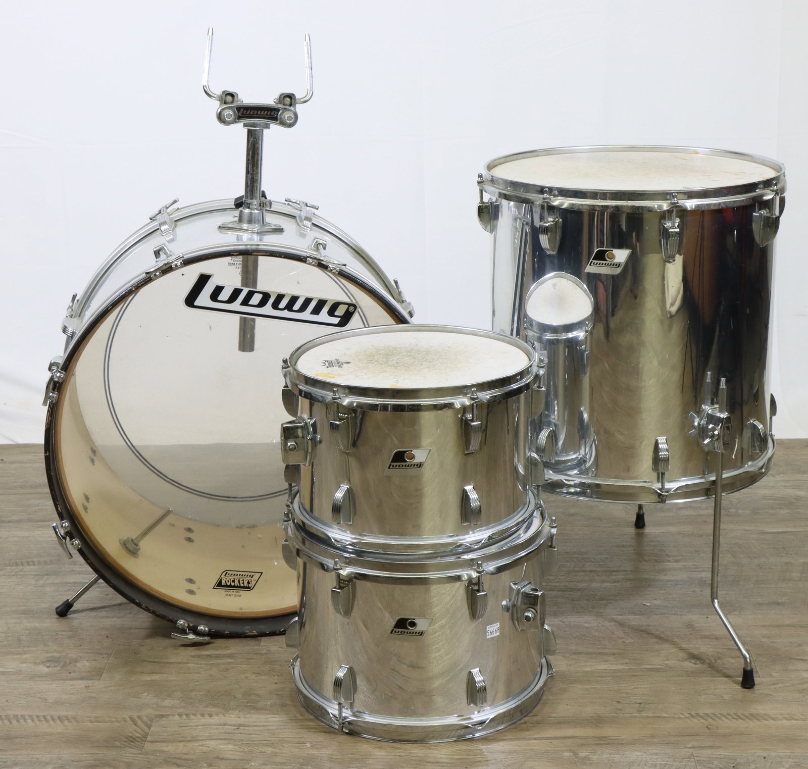Ludwig Drum Kit (Silver): Ludwig drum kit with silver finish. Includes 22x16 kick drum, 12x9 and 13x10 rack toms, plus 16x16 floor tom. Rack toms bracket included, but no other drum stands. No snare drum, kick drum beater or c