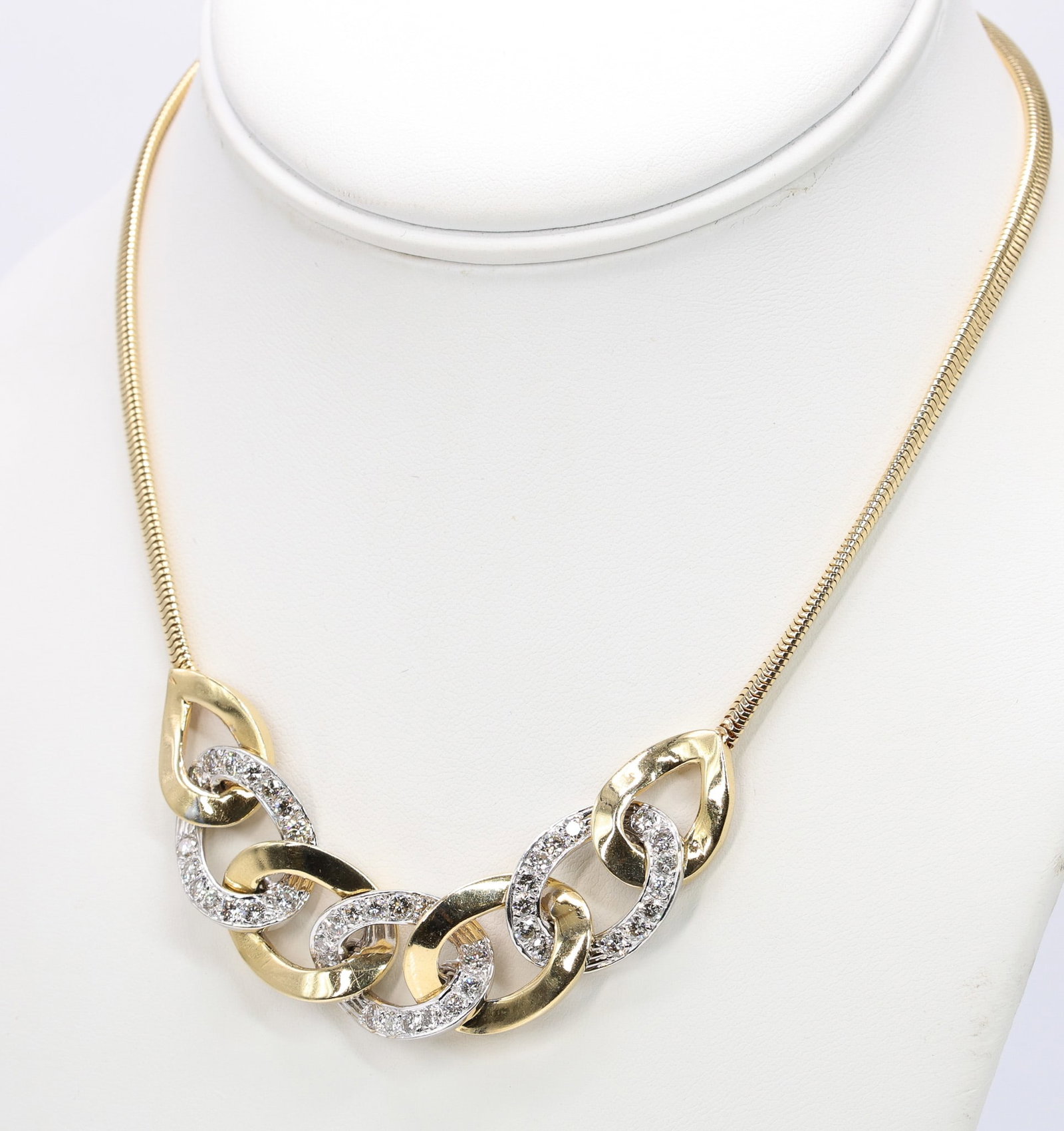 14k YG Diamond Necklace: 14k yellow gold snake chain necklace with 14k two tone Miami Cuban link set with round brilliant diamonds totaling approximately 3.36 carats, K color, SI2 clarity, 16" and 22.8dwt.