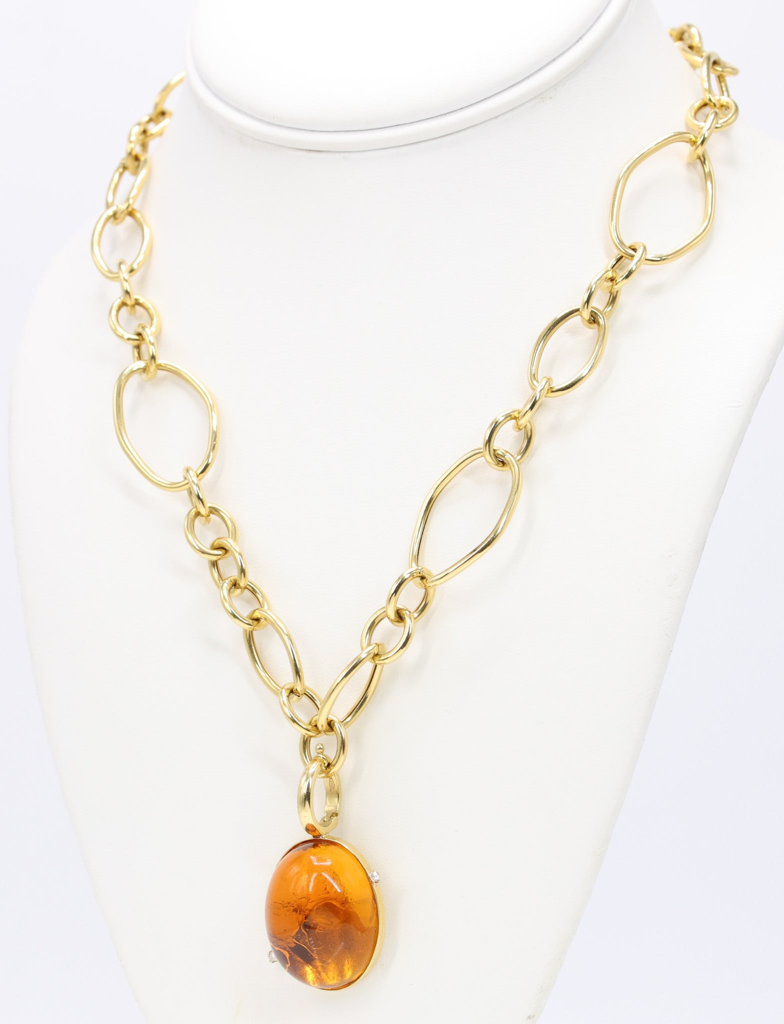 18k YG Citrine Diamond Necklace: 18k yellow gold open circle link necklace with enhancer pendant set with an oval citrine approximately 37 carats and two round diamonds totaling approximately .06 carats, chain 17.5" and 14.9dwt,