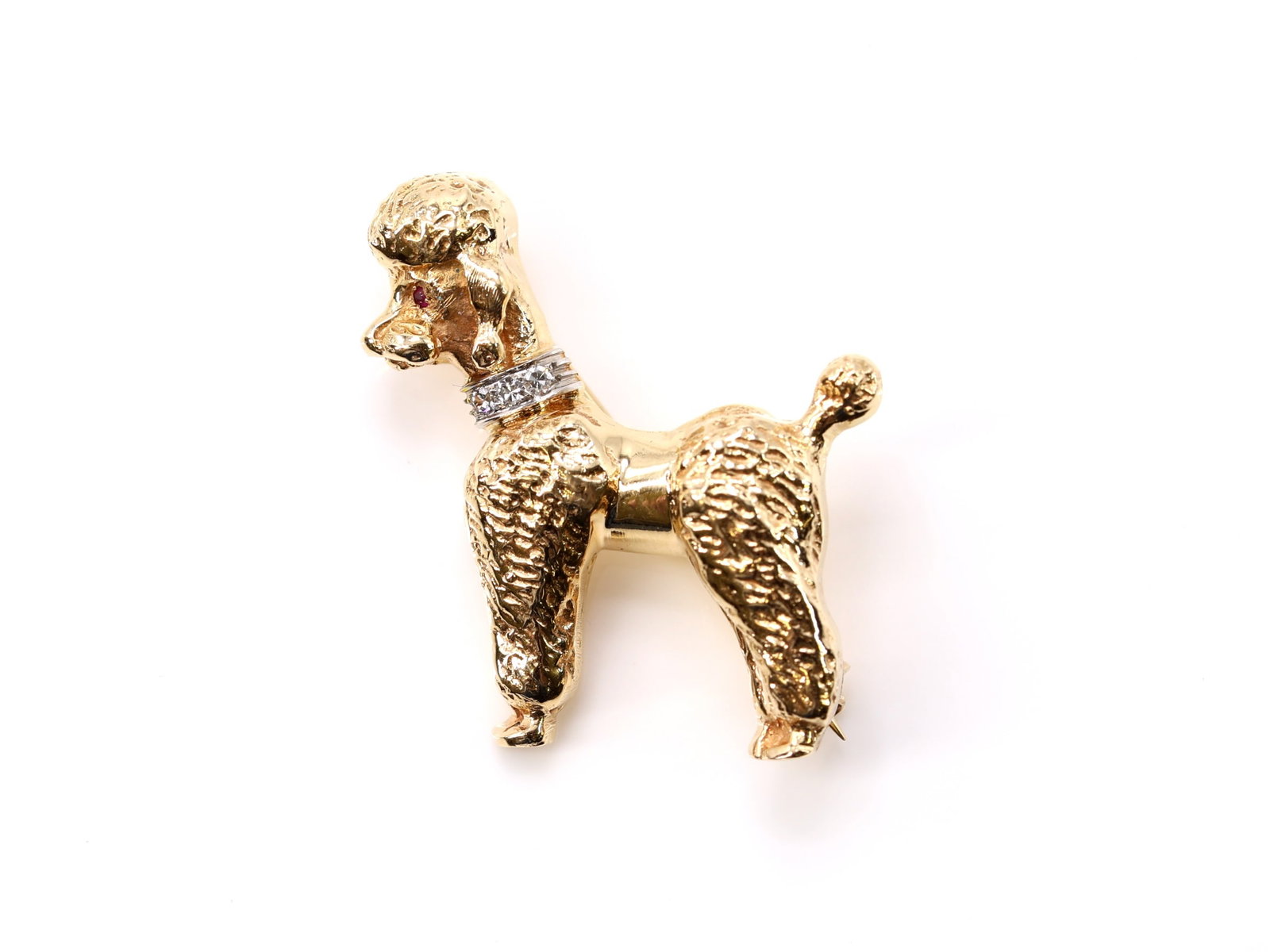 14k YG Diamond Pin: 14k yellow gold poodle style pin set with three single cut diamonds totaling approximately .06 carat and two rubies totaling approximately .03 carat, 1.38" x 1.25", 9.3dwt.