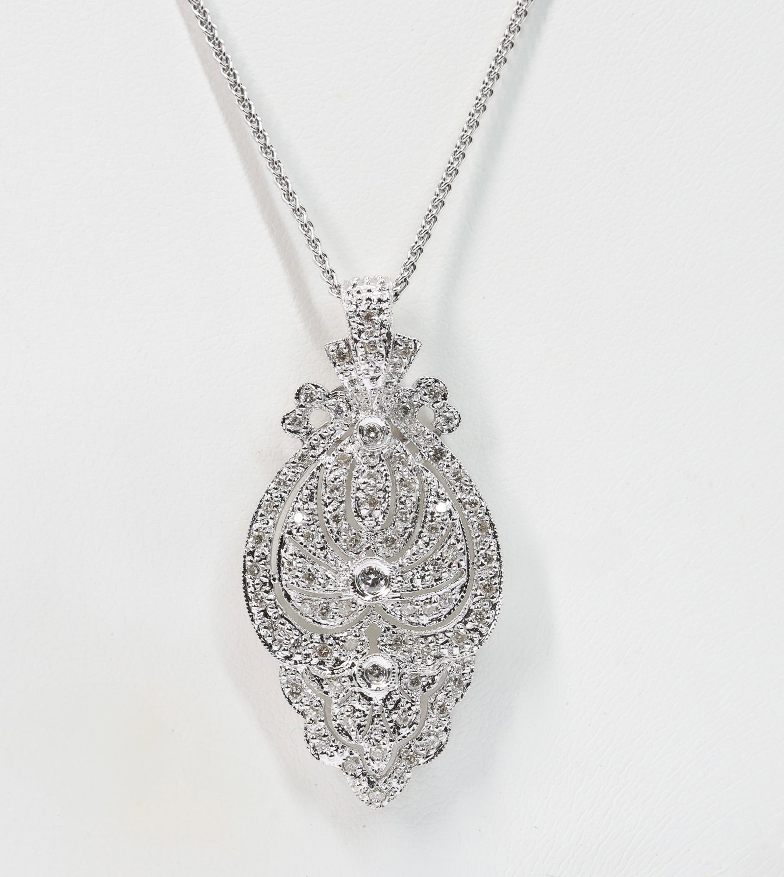 18k WG Diamond Pendant: 18k white gold antique style pendant set with 67 round brilliant cut diamonds, approximately 1.10ctw, I color, SI2 clarity, with 14k white gold chain, 5.7dwt.
