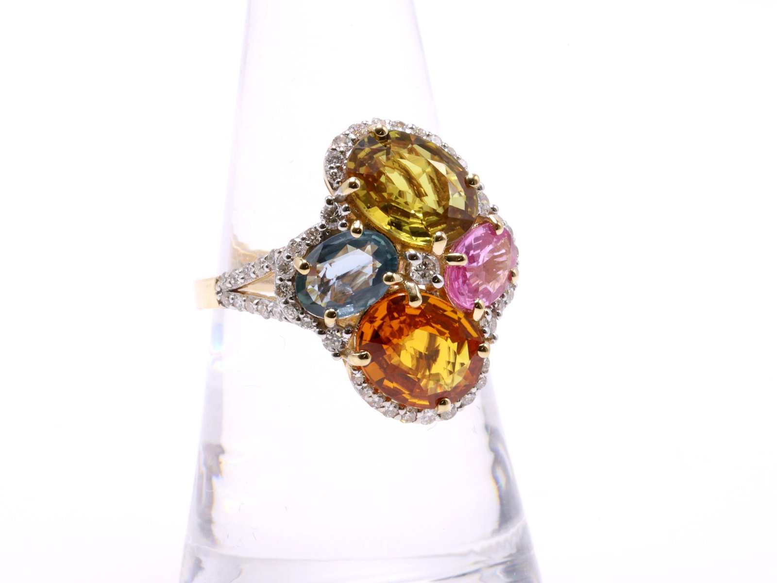 14K YG Sapphire Ring: 14k yellow gold custom made ring set with (4) oval cut natural multi color sapphires totaling 5.30 carats in prong settings and round brilliant cut diamonds totaling 0.53cttw. Independent Appraisal