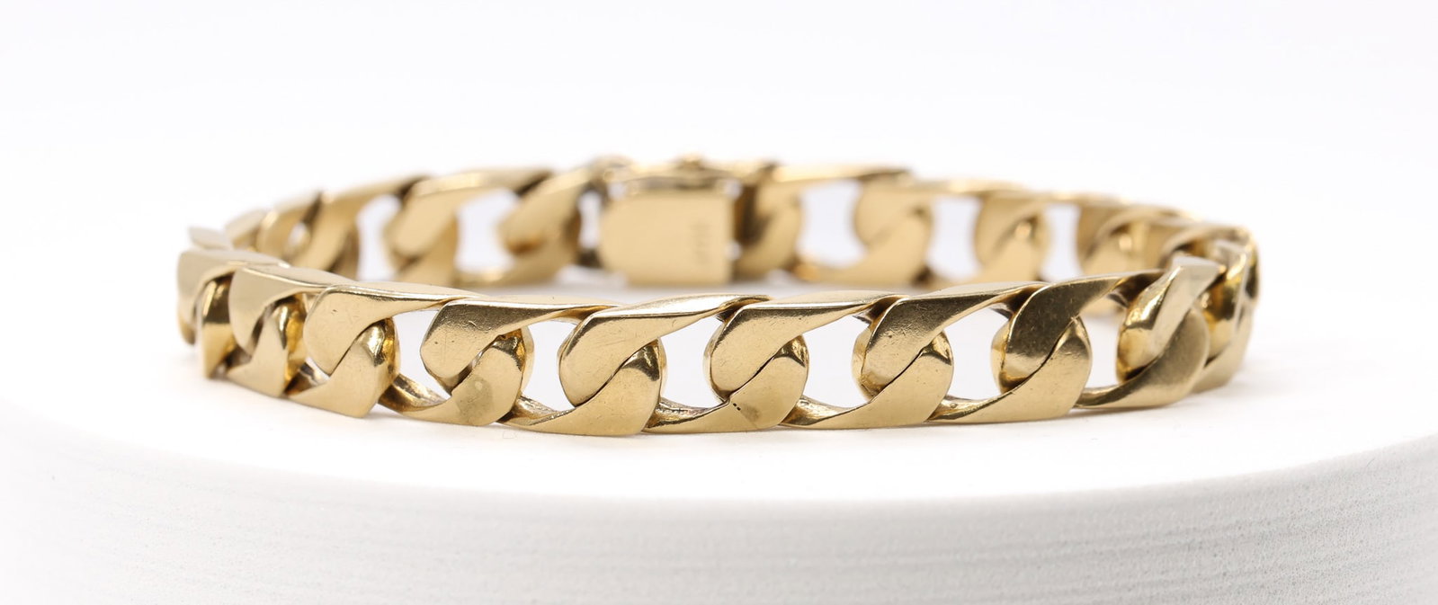 14k YG Bracelet: 14k yellow gold curb link bracelet, 8" length and 22.2dwt.
