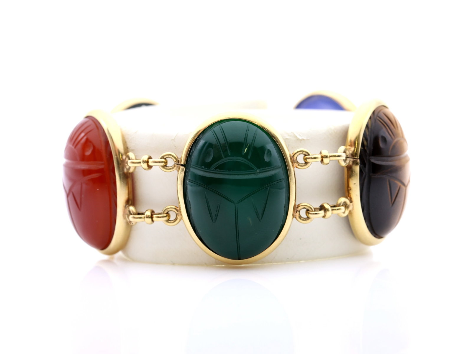 Binder Brothers 14k Scarab Bracelet: Binder Brothers, NY, 14k yellow gold scarab bracelet set with carved bloodstone, tiger’s eye, carnelian, and hardstone scarabs. Scarabs measure 1.25", bracelet 7.5", 39.4dwt.