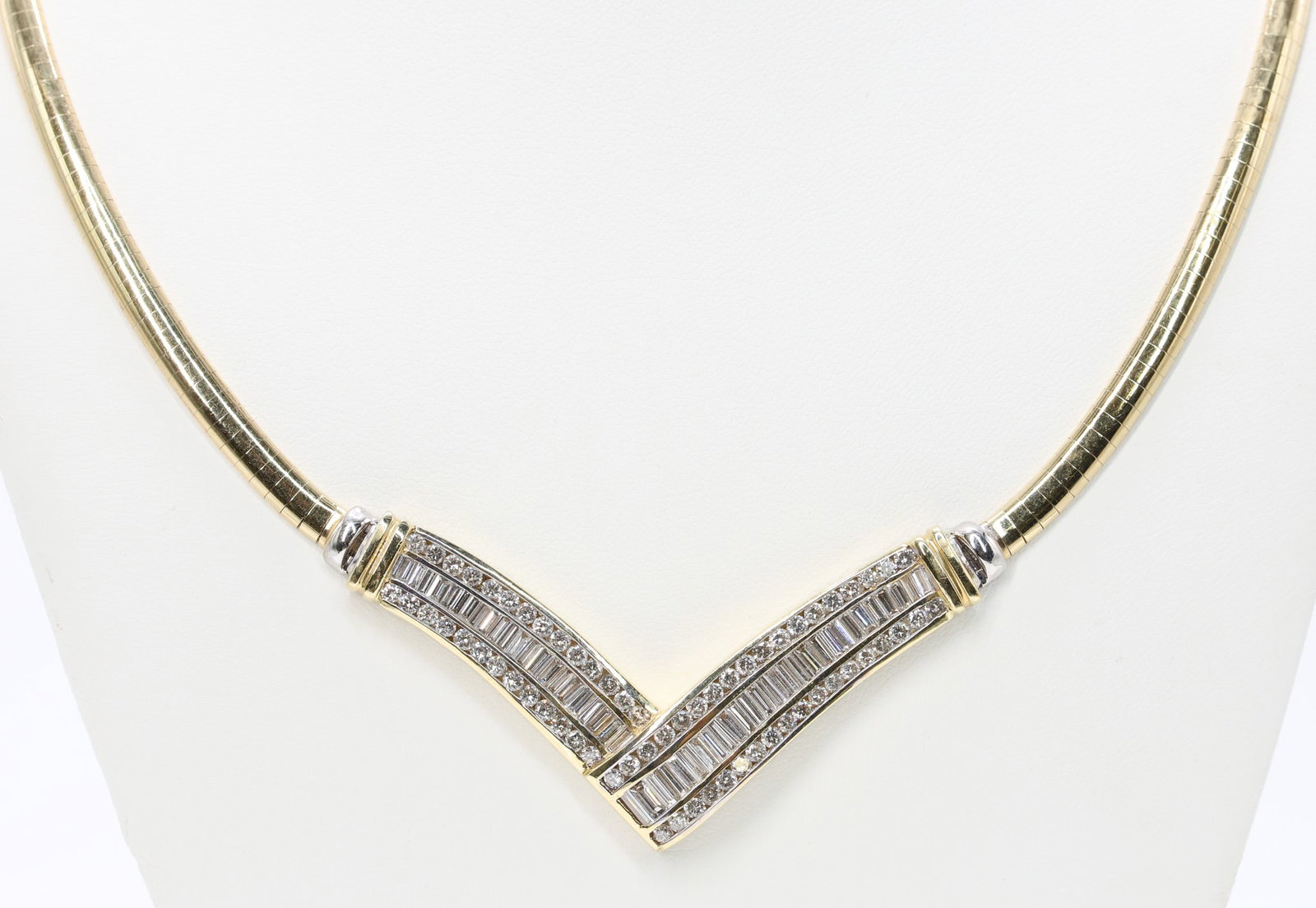 14k YG/WG Diamond Necklace: 14k two tone gold diamond necklace set with approx. 2.00ctw baguette cut diamonds and 2.00ctw round diamonds, 18", 21.2dwt.