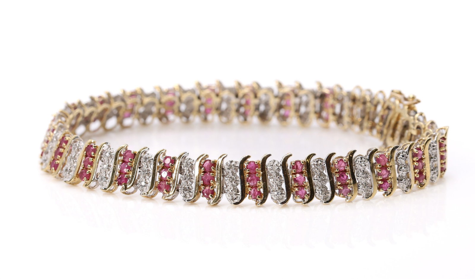 14k Ruby Diamond Bracelet: 14k yellow gold ruby and diamond bracelet with alternating curved links, 7.5", 8.75mm wide.