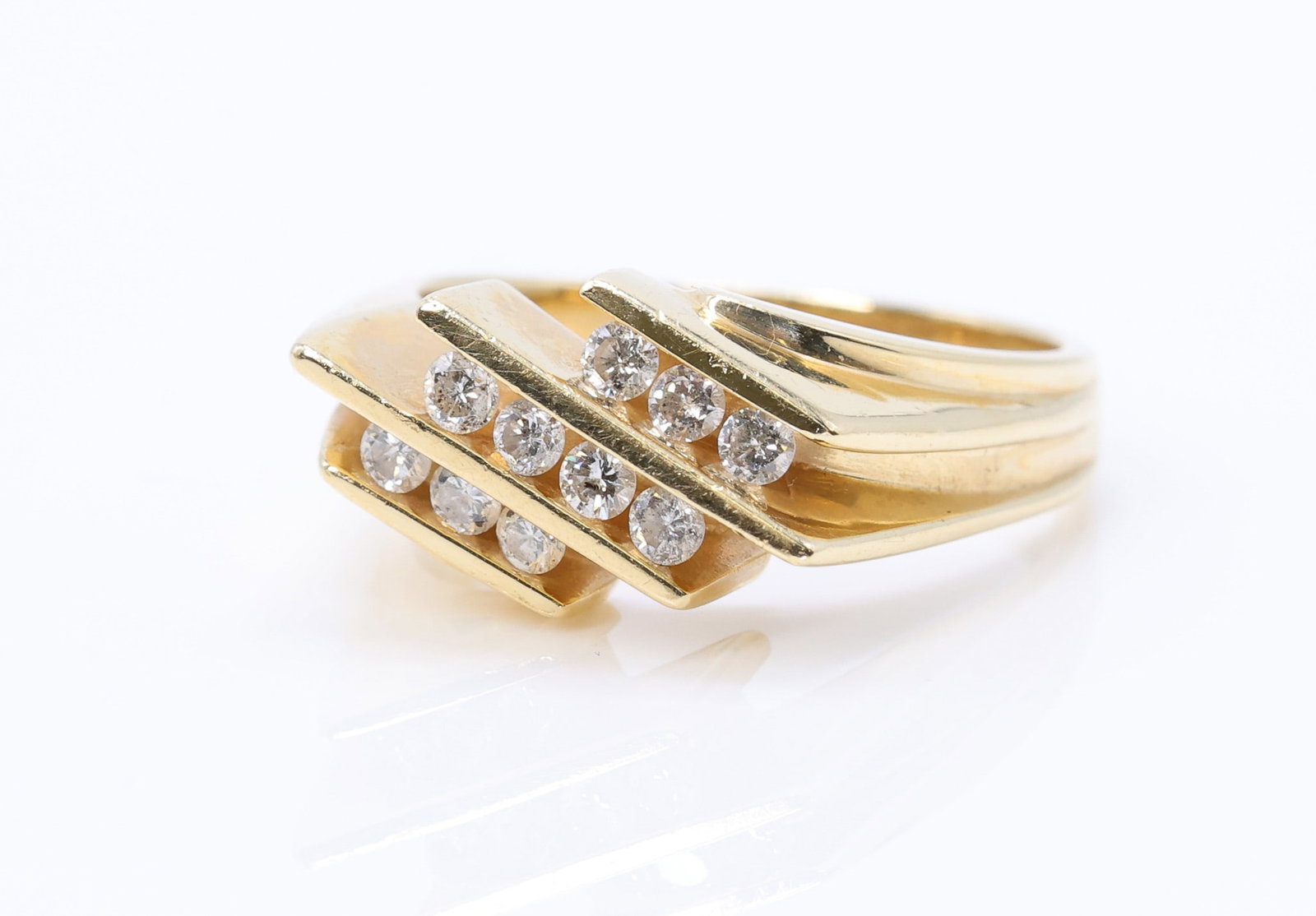 14k YG Diamond Ring: 14k yellow gold diamond ring set with approximately .50ctw round diamonds in a bypass design, size 7.75, 4.1dwt.