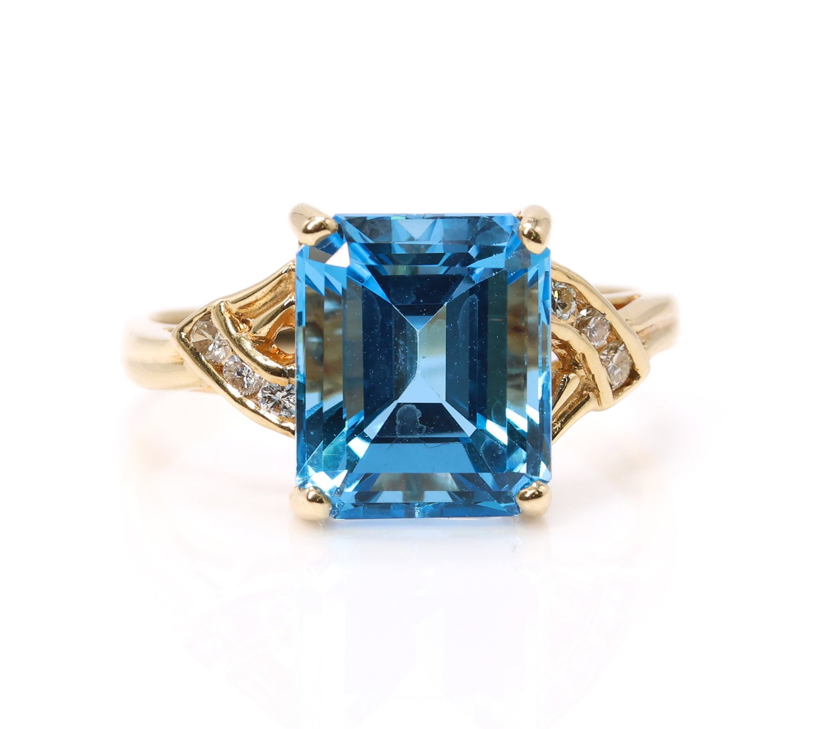 14k YG Topaz Diamond RIng: 14k yellow gold ring set with 8.5ct square cut blue topaz and round brilliant cut diamond accents, size 10.5, 3.7dwt.
