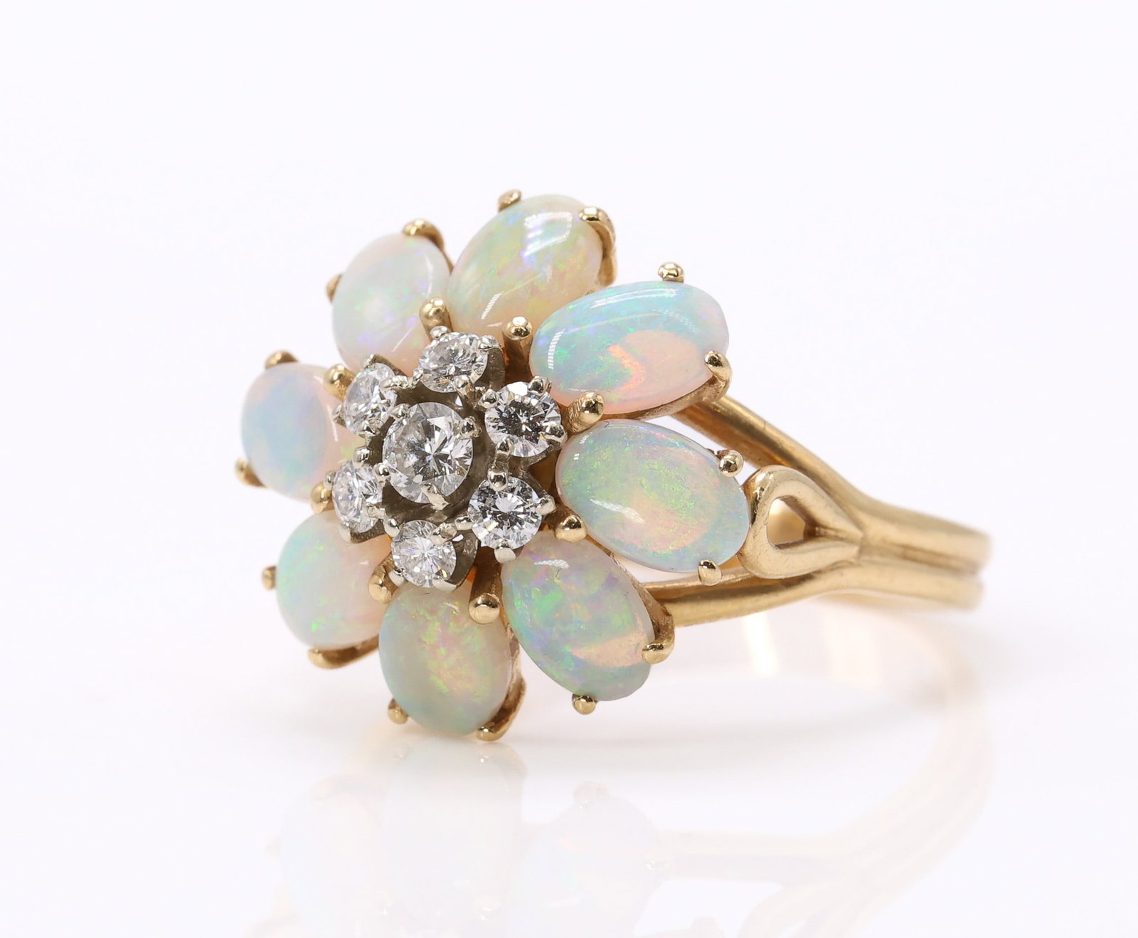 14k YG Opal Diamond Ring: 14k yellow gold ring set with oval opals measuring approximately 6mm and round brilliant cut diamonds totaling approximately 0.50ctw, size 8.5 and 3.8dwt.