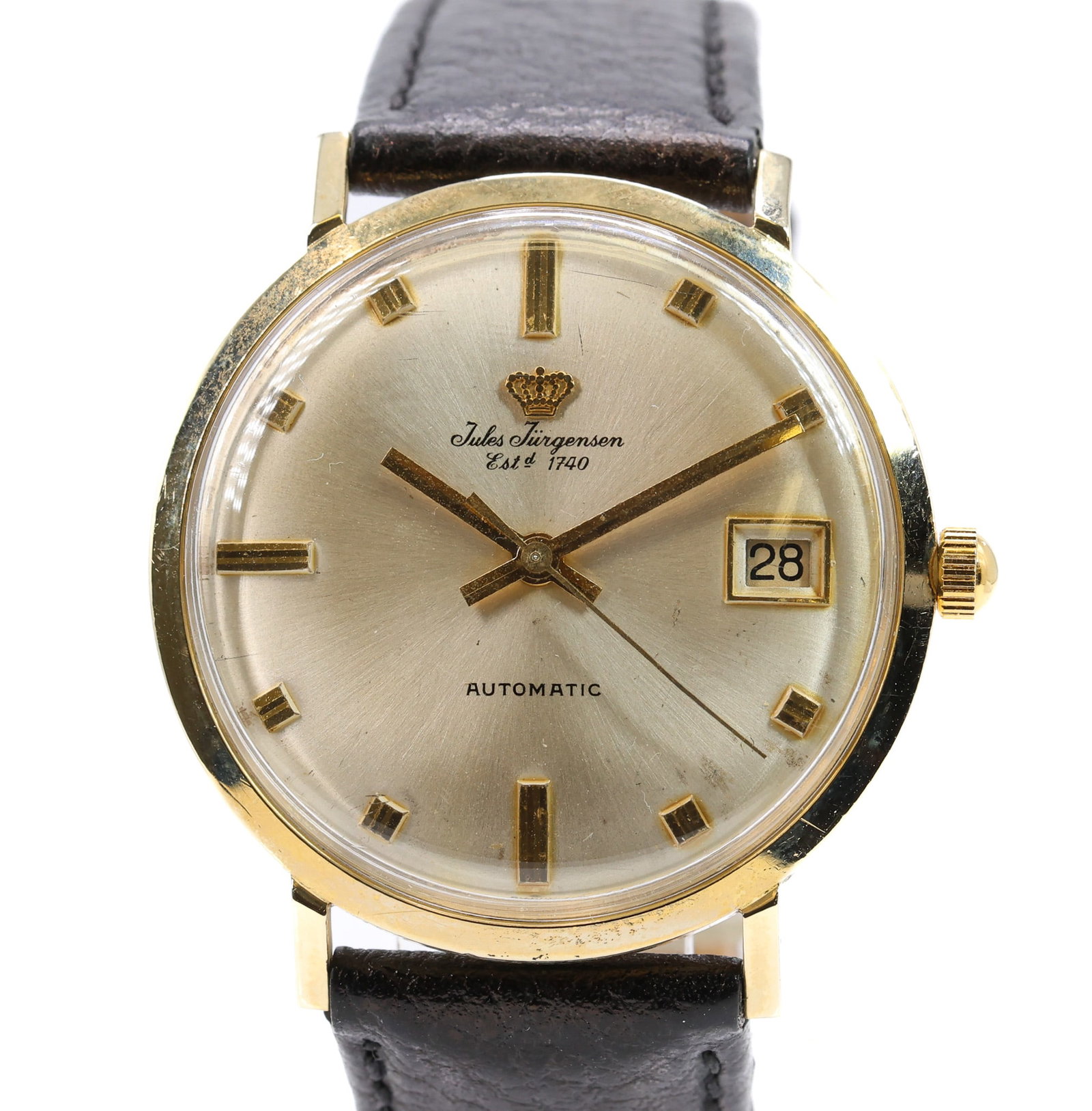 14k YG Jules Jurgensen Automatic Wristwatch: 14k yellow gold Jules Jurgensen automatic wristwatch with date aperture, champagne dial, black leather band. Case measures 34mm not including crown. Currently running.