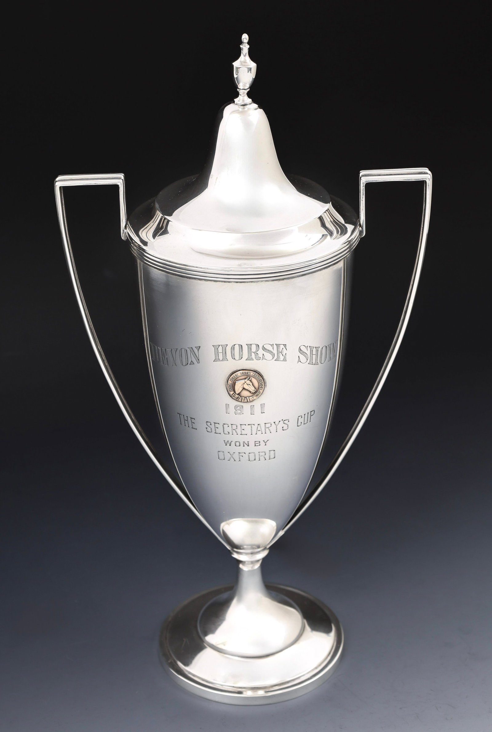 Sterling Silver 1911 Devon Horse Show Trophy: American sterling silver covered loving cup trophy, engraved "Devon Horse Show / 1911 / The Secretary's Cup / Won by Oxford", and featuring an inset bronze medallion for the Devon Horse Show