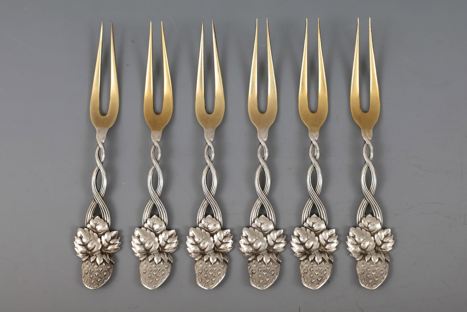 Tiffany Sterling Silver Strawberry Forks: American sterling silver strawberry forks, in the "Strawberry Pierced" pattern, with gold washed tines, circa late 19th - early 20th C. A set of (6). 4.25”. 3.01 ozt