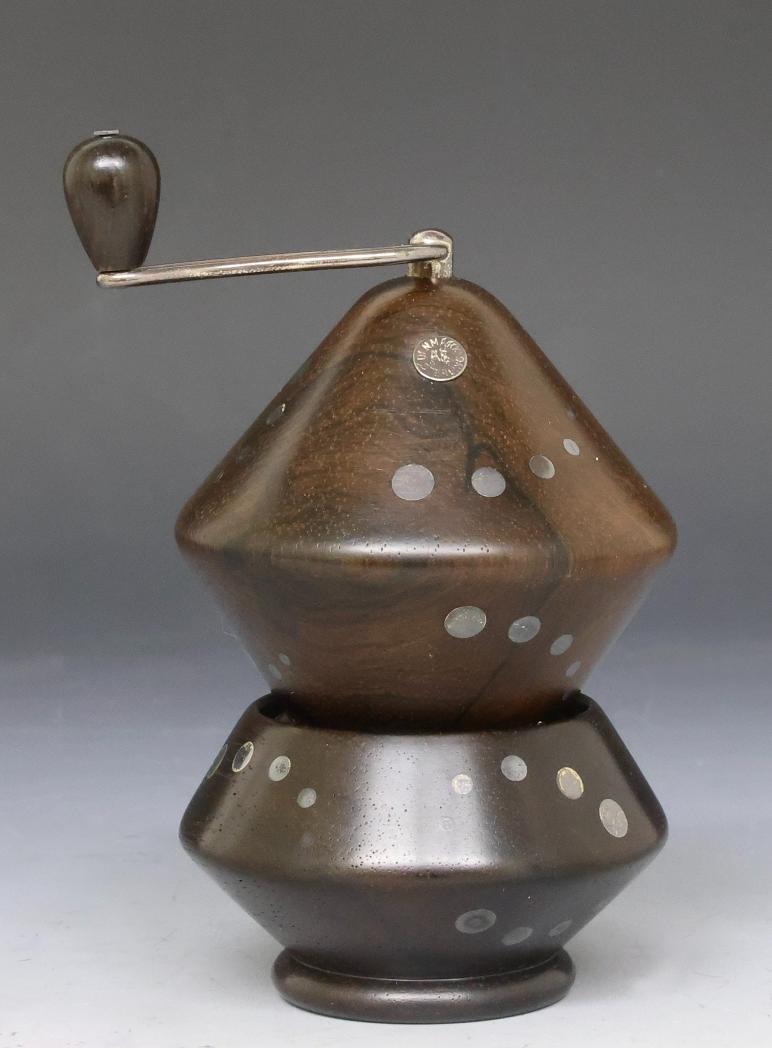 Axel Salomonsen Salt and Pepper Set: Danish Modern rosewood salt cellar and pepper mill with inset sterling silver medallions, by Axel Salomonsen. (2) pieces. Salt 2"h x 2.75"w, pepper mill 3.75"h x 2.75"w