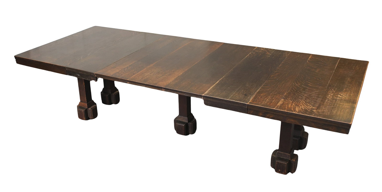 Charles Rohlfs Arts and Crafts Extension Dining Table: Quarter-sawn oak, square/rectangular extension top with five block-and-turn legs on casters. Stamped signed on frieze. 30"h x 53.5"w (Full Ext. 120"w, 5 leaves) x 48"d