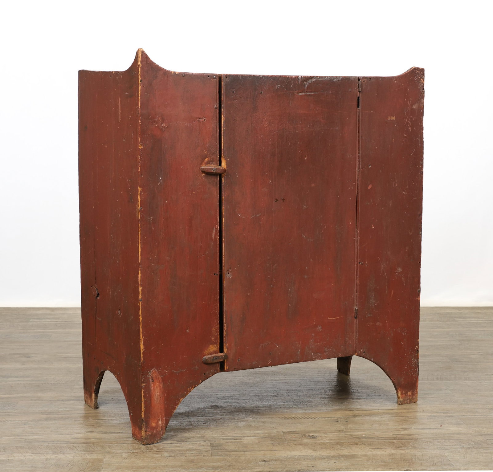 Red Painted Jelly Cupboard: One door with fitted shelving on cut-out feet. Loss to the one top corner. Mid 19th c. 42"h x 37"w x 18"d