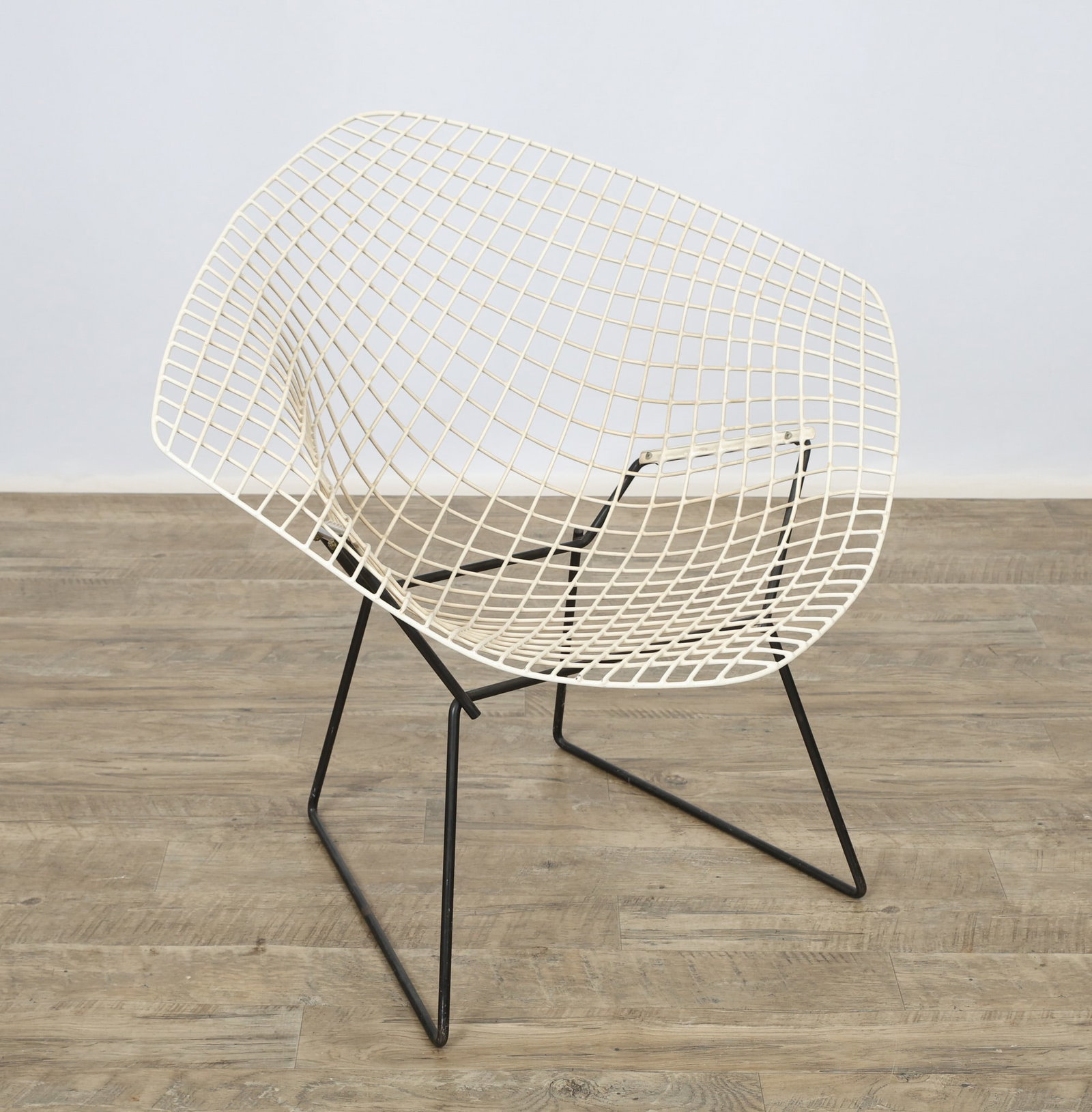 Harry Bertoia for Knoll Diamond Chair: Wire chair in white with a black tubular steel base. 30"h x 33.5"w x 20"d, 15"seat height.