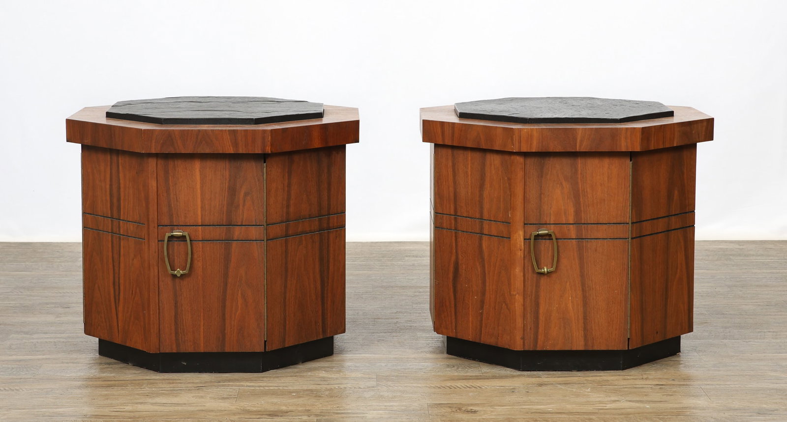 Slate Top Side Tables: Walnut octagonal pair of side tables with inset slate tops, each with two doors which open to storage space, with ebonized bands and bases, and brass hardware. The interior of one table shows