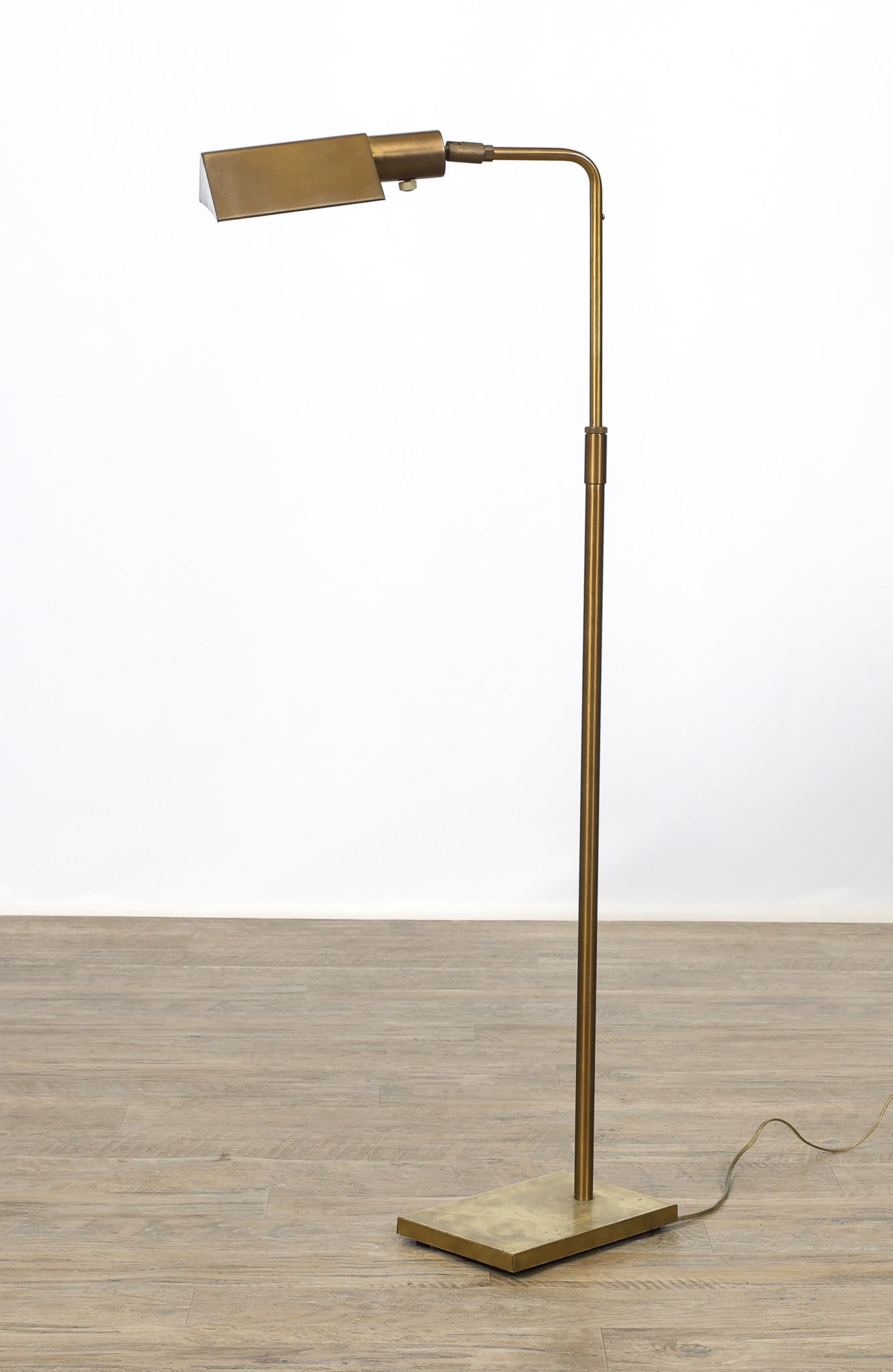 Koch and Lowy "Tent Shade" Floor Lamp: Brass adjustable floor lamp with tent shades and rectangular bases, marked for Koch and Lowy. In working condition. The surface is tarnished. Adjusts from 34"h to 44"h