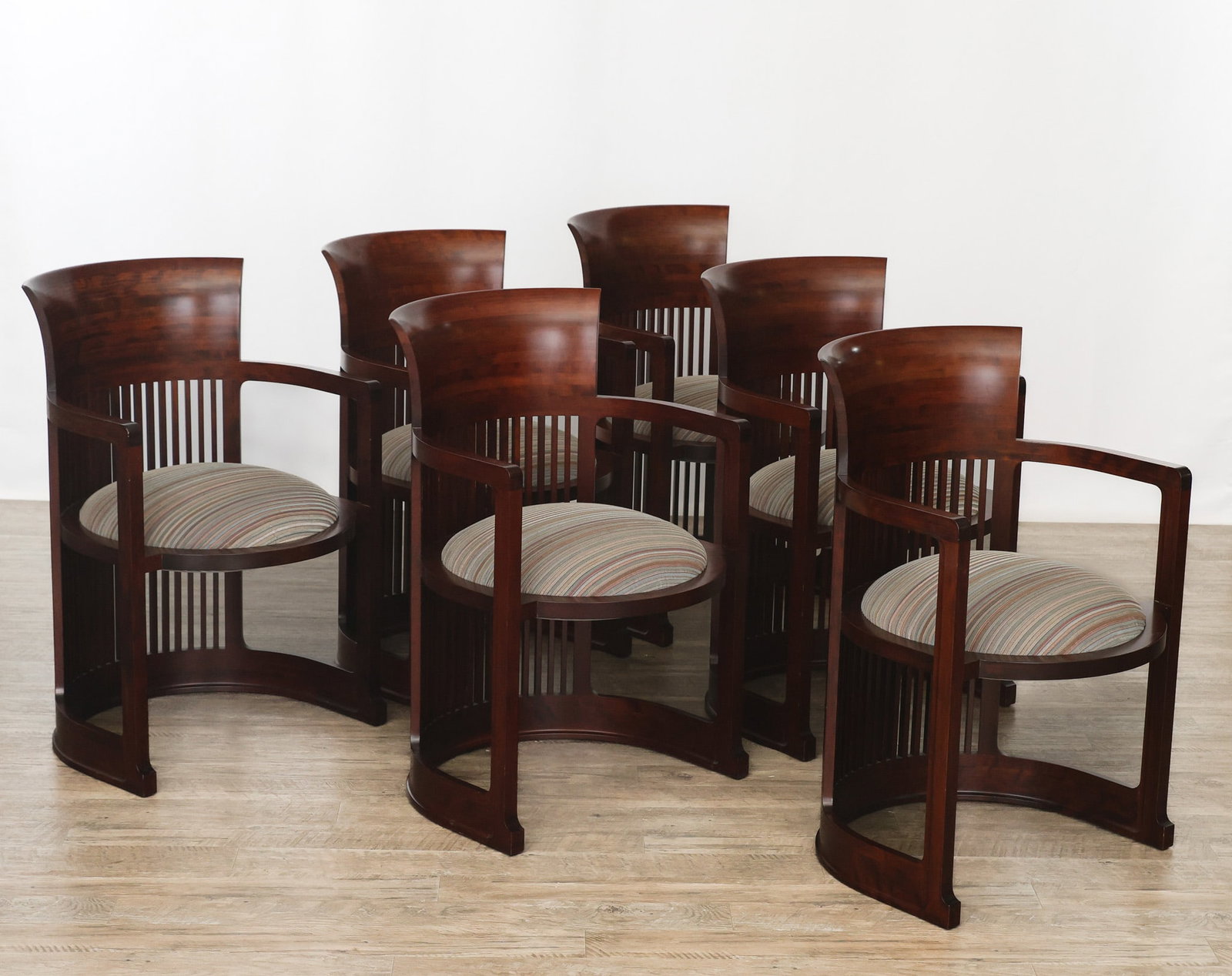 Cassina "Frank Lloyd Wright Model 606" Barrel Chairs: Cassina iMaestri Collection cherry barrel chairs, featuring bent wood construction, slat backs, and removable seats with striped polychrome fabric upholstery. Certified by the Frank Lloyd Wright