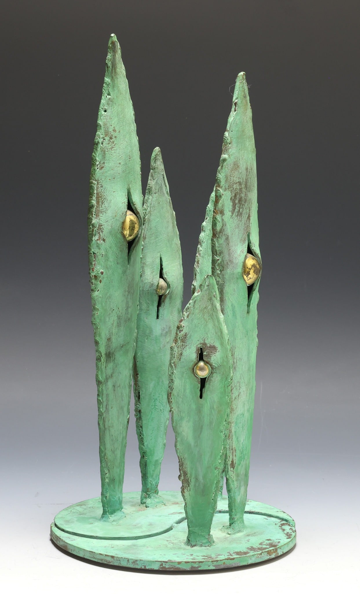 Raymond Granville Barger (1906 - 2001): Brutalist sculpture with a phytomorphic motif, green patinated bronze with brass accents, impressed with the artist's initials and dated 1975 at the base. 14"h, 7.25"w at the base