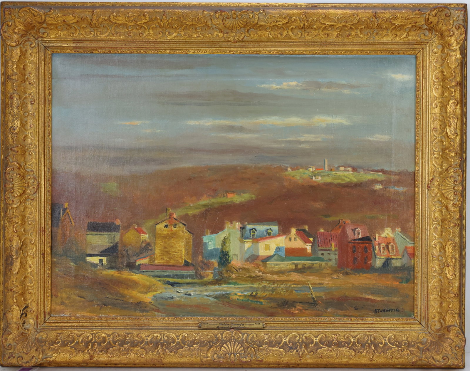 Walter Stuempfig, Jr (1914 - 1970) in Newcomb Macklin Frame: Oil on canvas, SLR. PA Impressionist townscape with farmhouse and fields in the distance. Canvas measures 16”h x 22”w and housed in Newcomb Macklin frame 22”h x 28”w. From the 