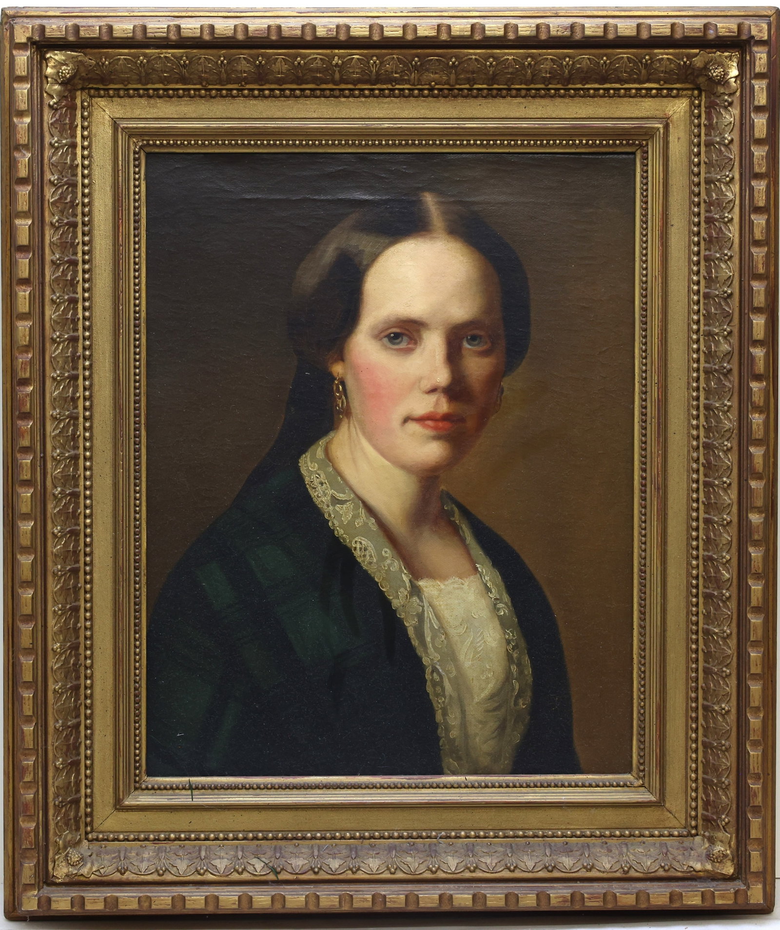 American School Portrait: Oil on canvas, American School realist portrait of a woman in dark dress with lace collar and earrings. 19"h x 15.5"w and 27.5"h x 23.5"w framed