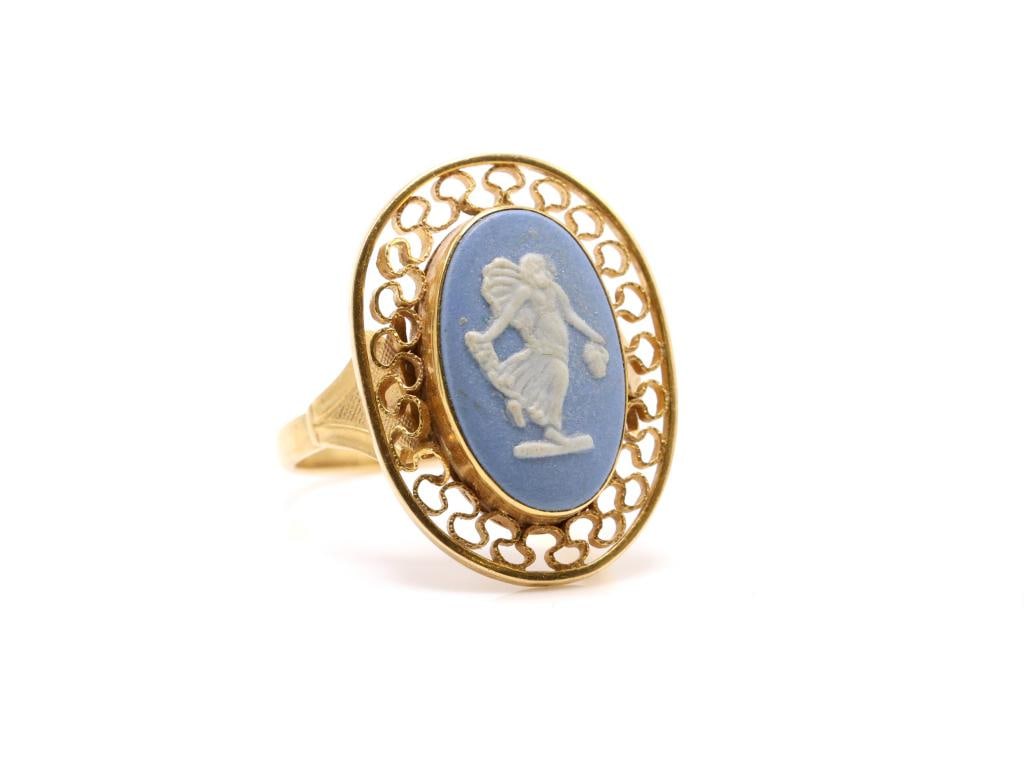 14k YG Wedgwood Jasperware Ring: 14K yellow gold ring set with an oval blue and white Wedgwood jasperware cameo within an openwork filigree surround. Size 5.5 and 2.6 dwt.