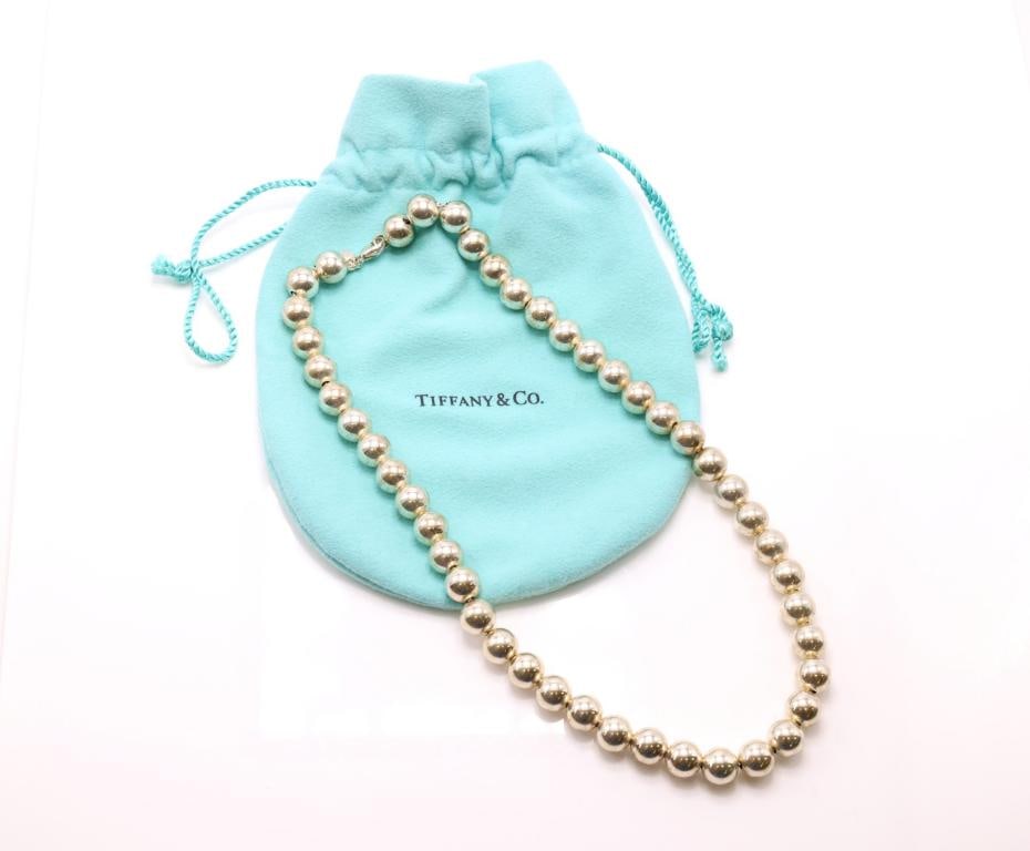 Tiffany & Co. Sterling Silver Necklace: Tiffany & Co. sterling silver bead necklace, comprised of polished beads with lobster clasp. Includes Tiffany & Co. pouch. 18", 1.47 ozt.