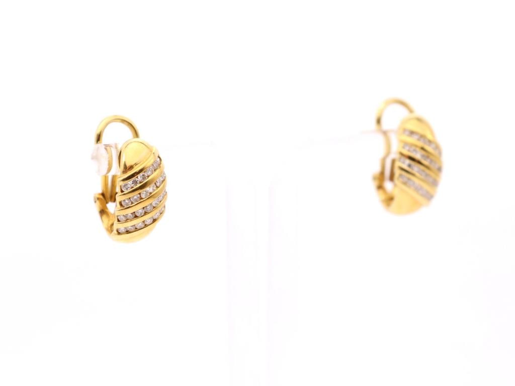 18k YG Diamond Earrings: Pair of 18K yellow gold diamond hoop earrings, each with diagonal rows of round chanel set round brilliant cut diamonds, approximately 0.75 in., 5.0 dwt.