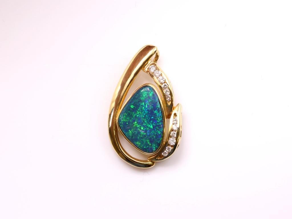 18k YG Opal Diamond Pendant: 18K yellow gold opal and diamond pendant, bezel set freeform opal with diamond accents, 1 in., 3.3 dwt.