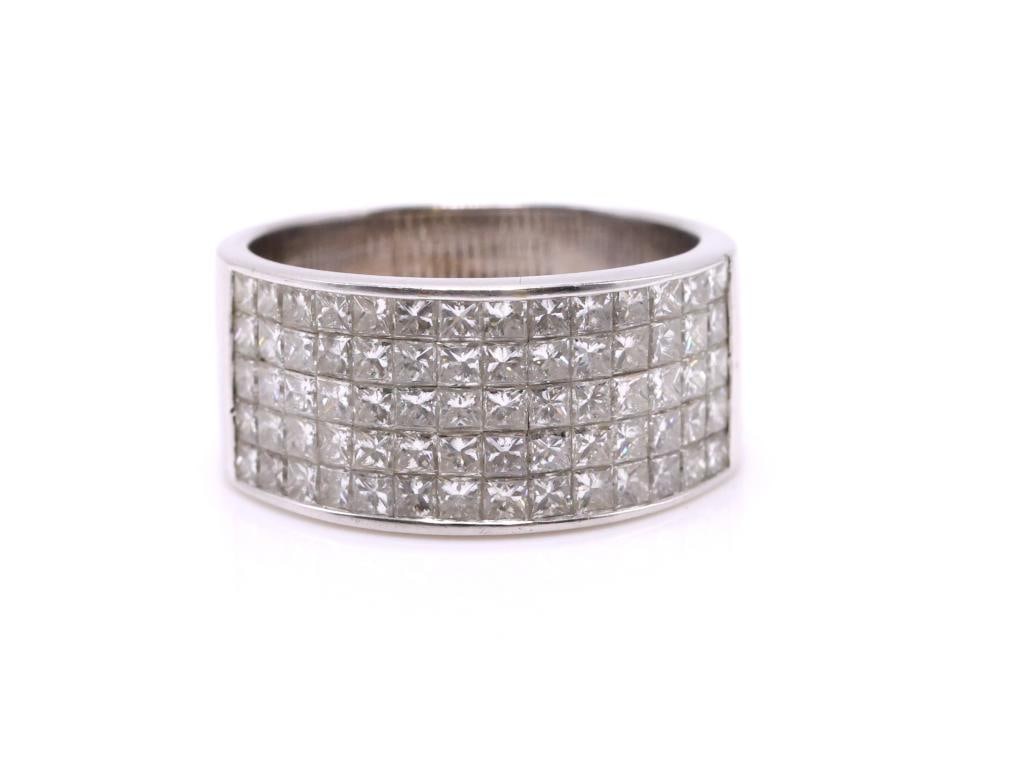 18k WG Diamond RIng: 18K white gold diamond band ring, set with approximately 1.50 ctw princess cut diamonds, Size 6.5, 5.1 dwt.