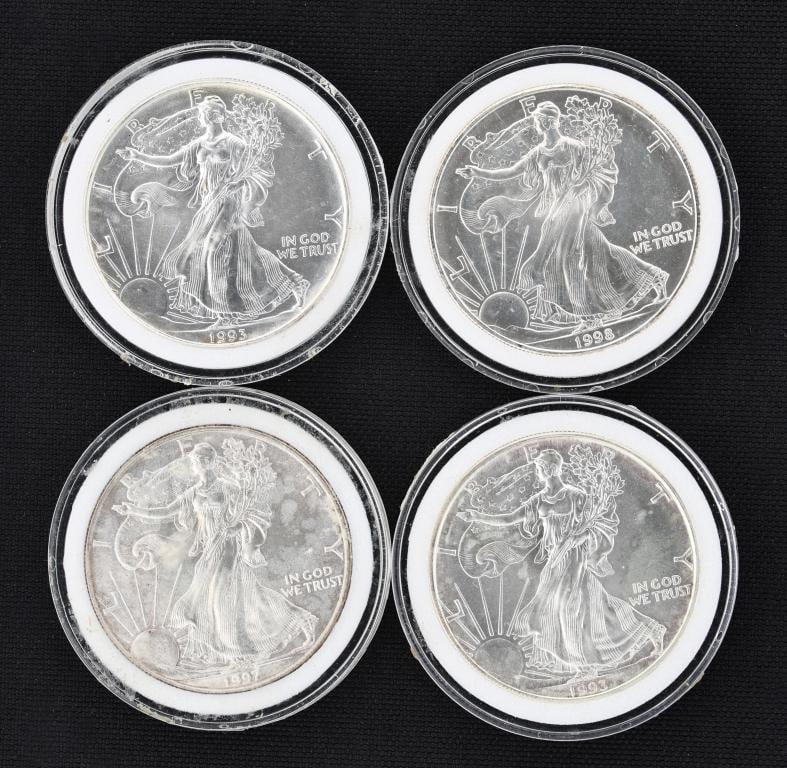 American Silver Eagle Dollar Coins: US uncirculated fine silver dollar coins, 1993 (x2), 1997, and 1998. (4) coins. 40.6 mm and approx. 1.0 ozt, approx. 4 ozt overall