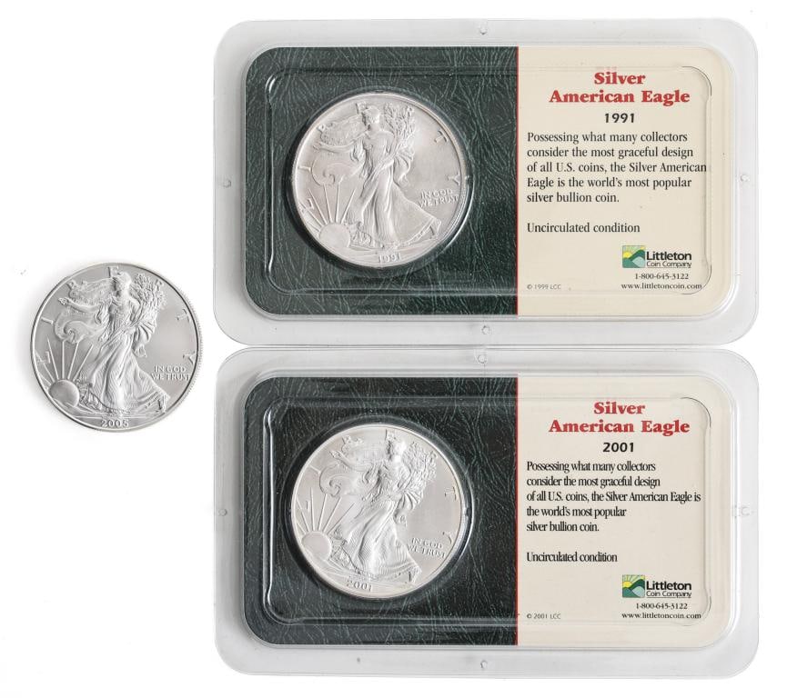 American Silver Eagle Dollar Coins: US uncirculated fine silver dollar coins, 1991, 2001, and 2005. (3) coins. 40.6 mm and approx. 1.0 ozt, approx. 3 ozt overall