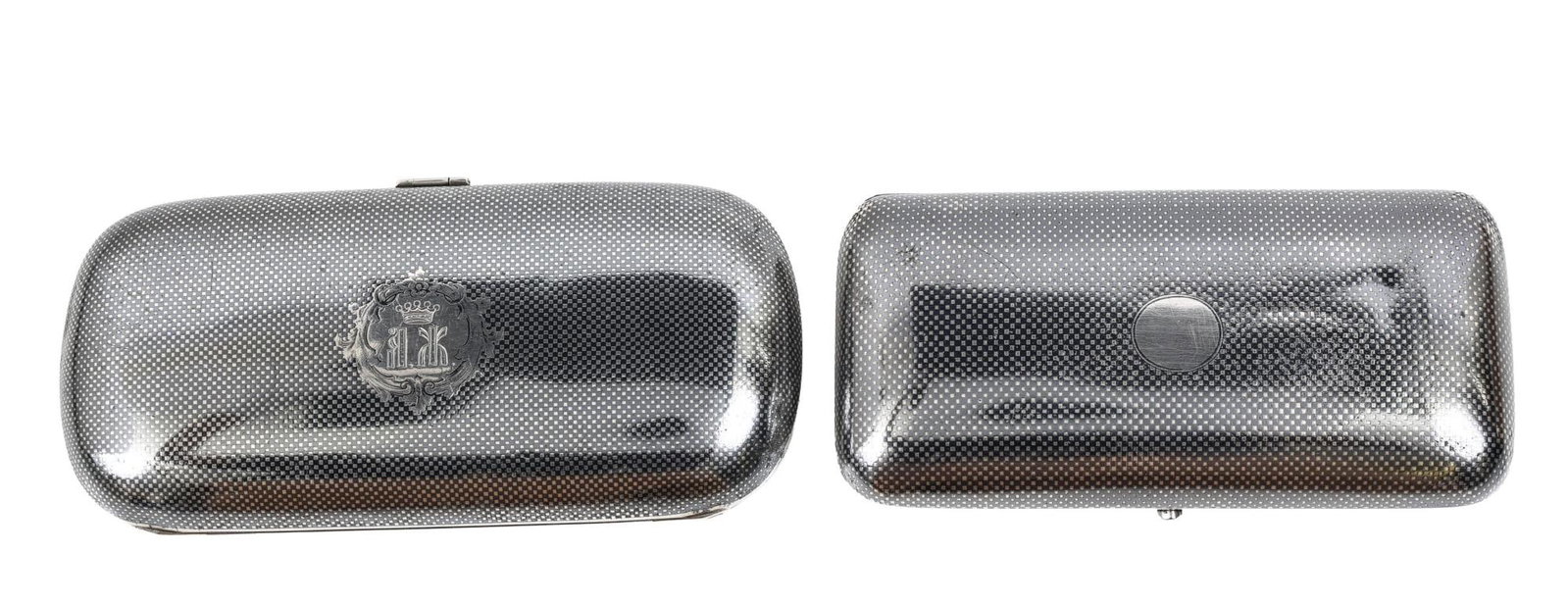 Imperial Russian Silver Cigarette Cases: Imperial Russian 84 kokoshnik (875 silver) cigarette cases with niello basketweave decoration, including an oval example with monogram and engraved crest, marked for Moscow, 1862, assayer Viktor Savin