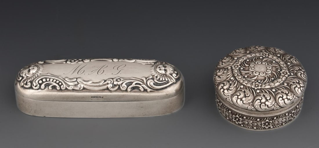 Tiffany Sterling Silver Boxes: American sterling silver pieces, including a round pill box with repousse foliate and floral decoration, featuring a gold washed interior, pattern no. 10445, marked for the directorship of Charles L. 