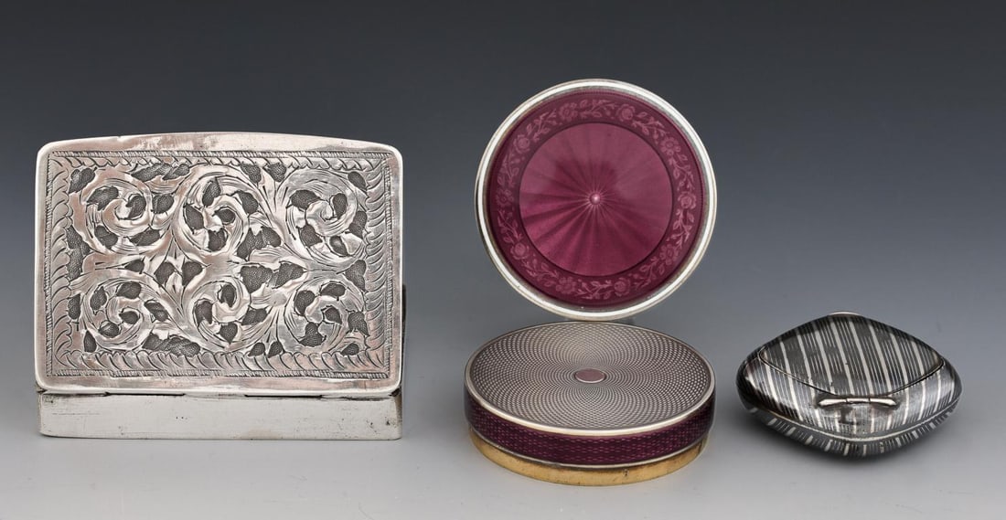 Continental and North African Silver Boxes: French 800 silver round compact with amethyst enameled guilloche decoration and gold washed interior, by Charles Brunner, 2"w x 0.5" thick. Swiss 800 silver square compact with niello decoration, and