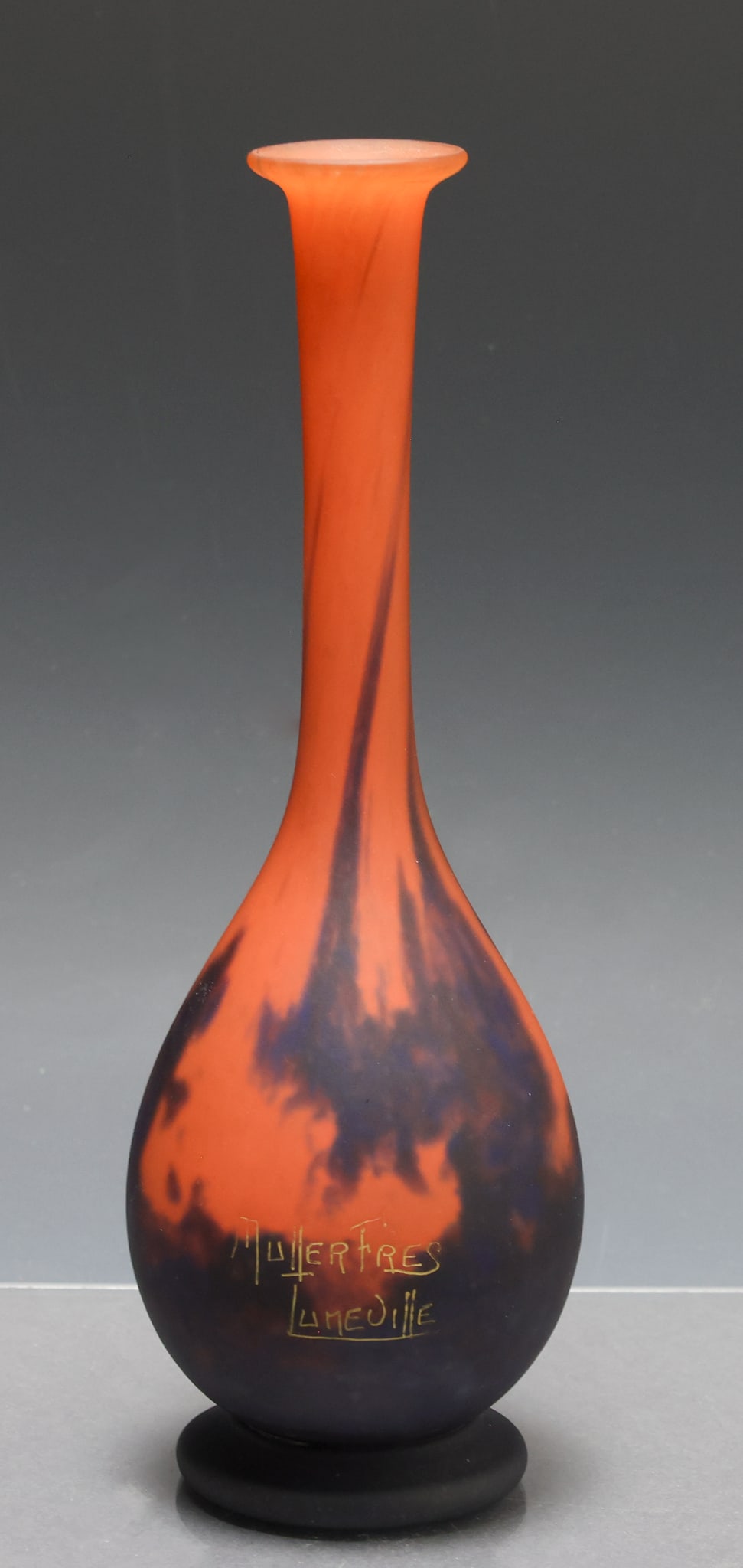 Muller Freres Cameo Glass Vase: French Art Nouveau cameo glass bottle vase with a flared mouth, in mottled orange and black with a matte finish. Etched Muller Fres. Luneville to the side. 8.75"h x 3"w