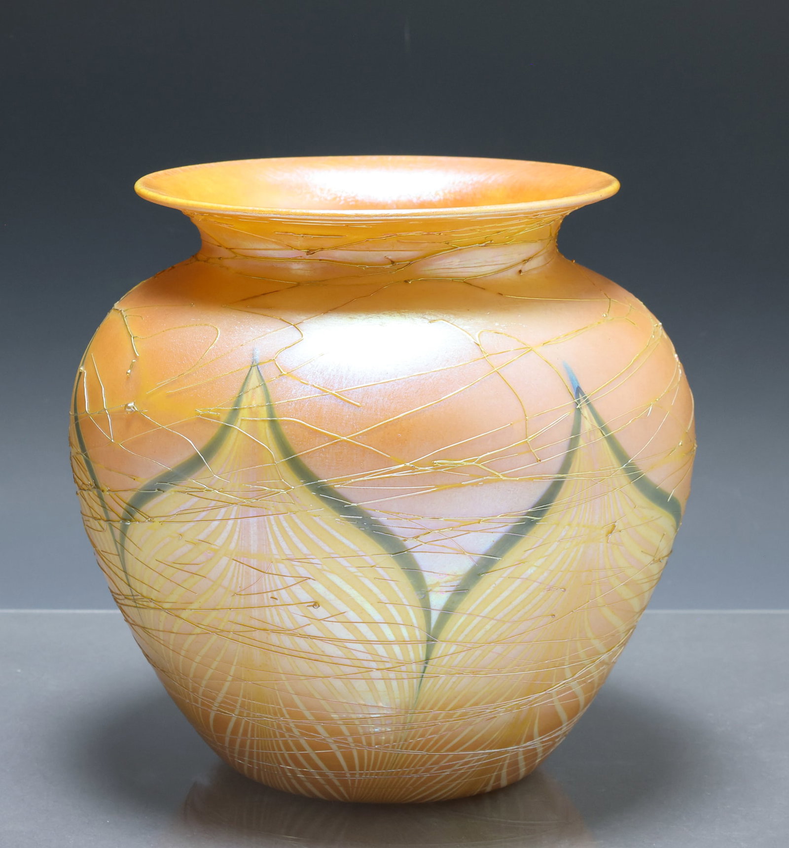 Durand Threaded Glass Vase: Art Nouveau iridescent glass bulbous vase with a flared mouth, featuring a yellow and white pulled feather motif on an orange ground and overlayed with threading. Etched Durand 1710-8 to the foot. Are