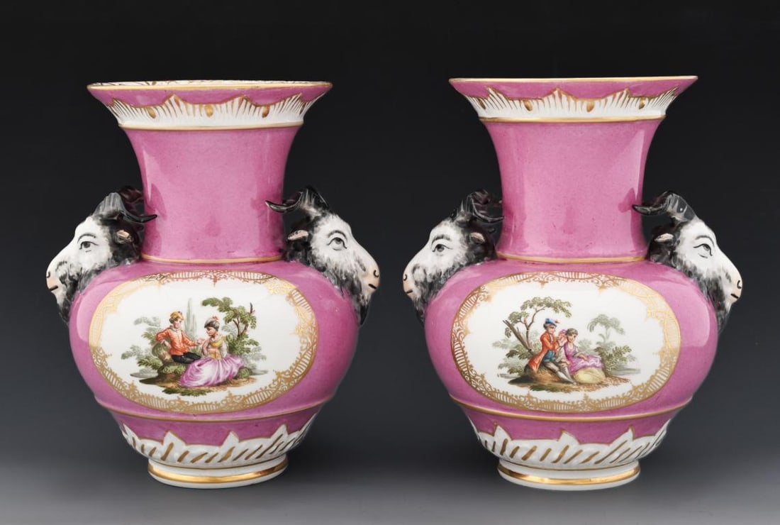 KPM Porcelain Vases: German porcelain pair of baluster vases with panels to each side depicting complementing hand painted scenes of courting couples, on a fuchsia ground with gilt accents and textured details, featuring